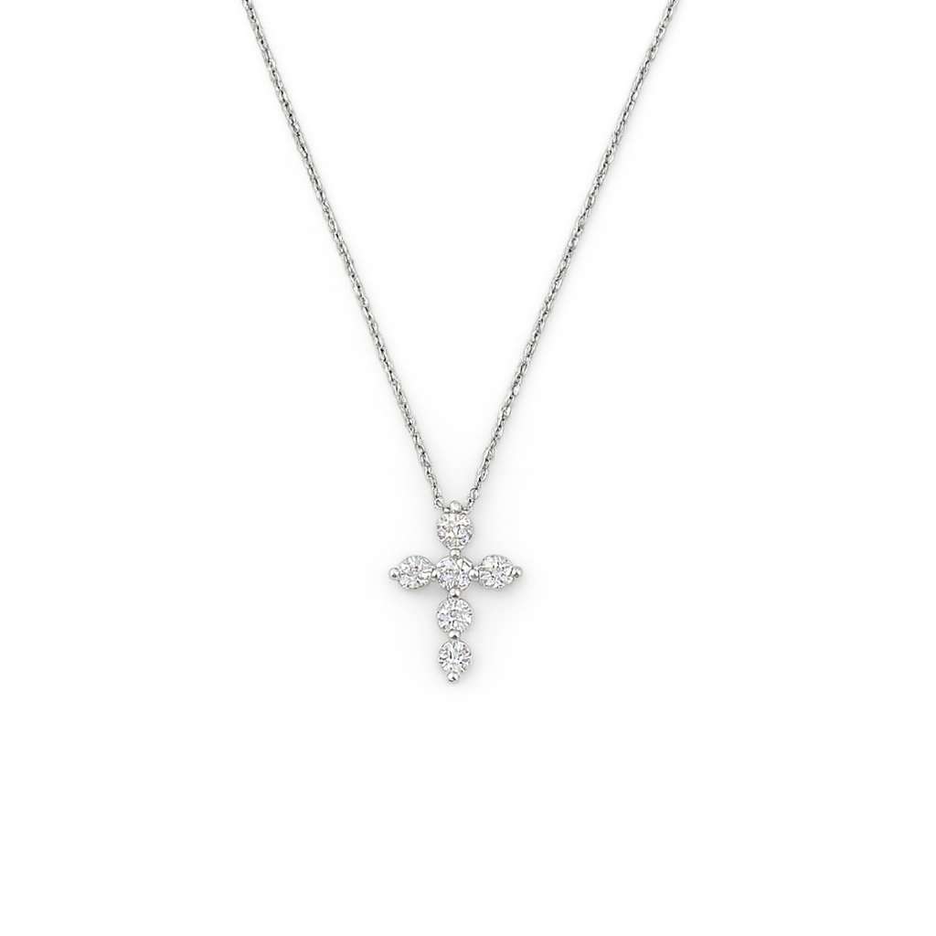 Silver and lab diamond cross necklace on a white background