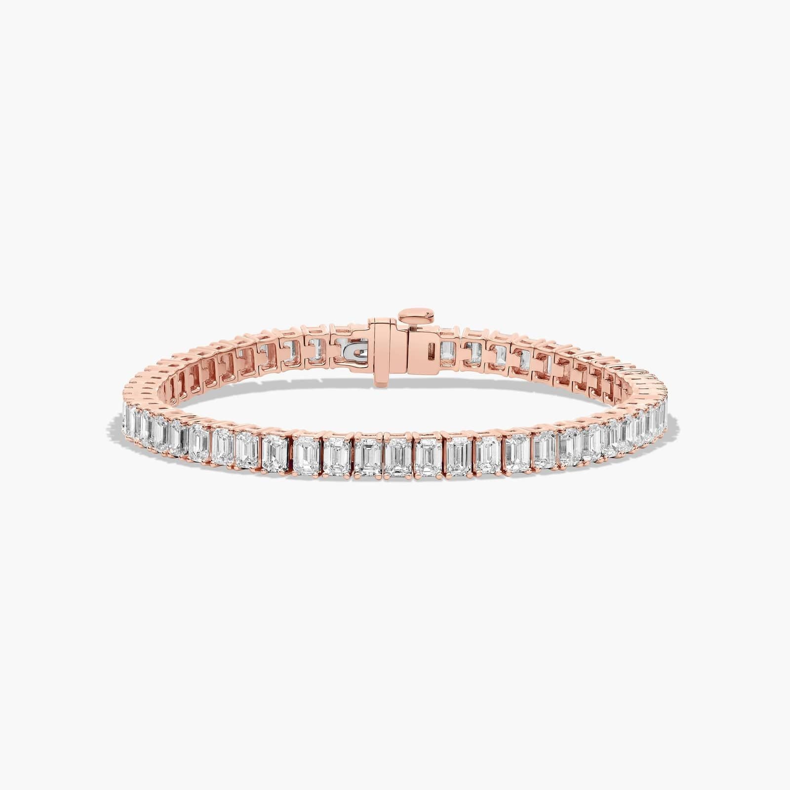 Rose gold version of the Always Evolving tennis bracelet, angled to highlight the clasp and brilliance of the emerald cut diamonds.