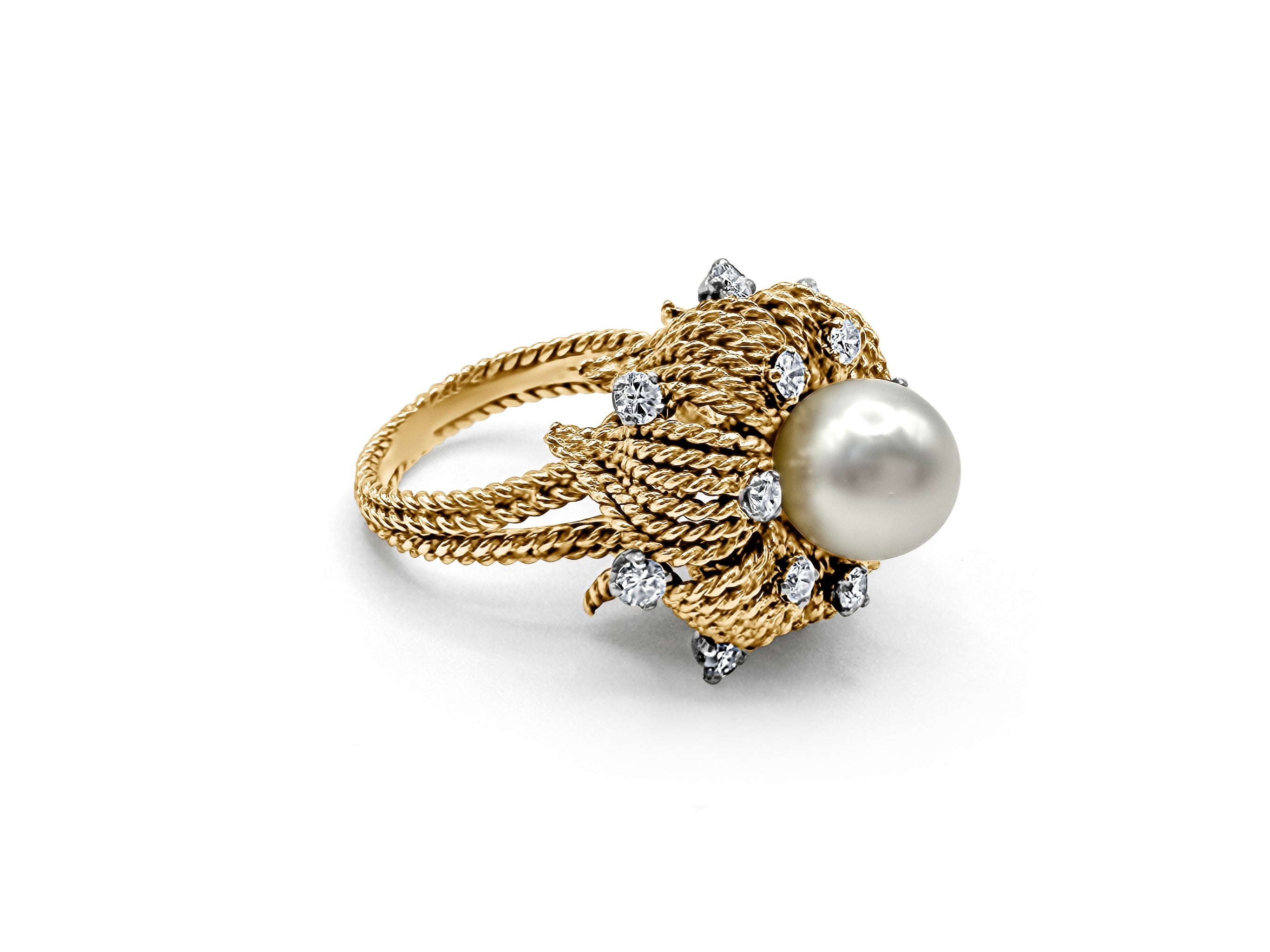 Side view of antique 14k gold pearl and diamond ring with floral detailing