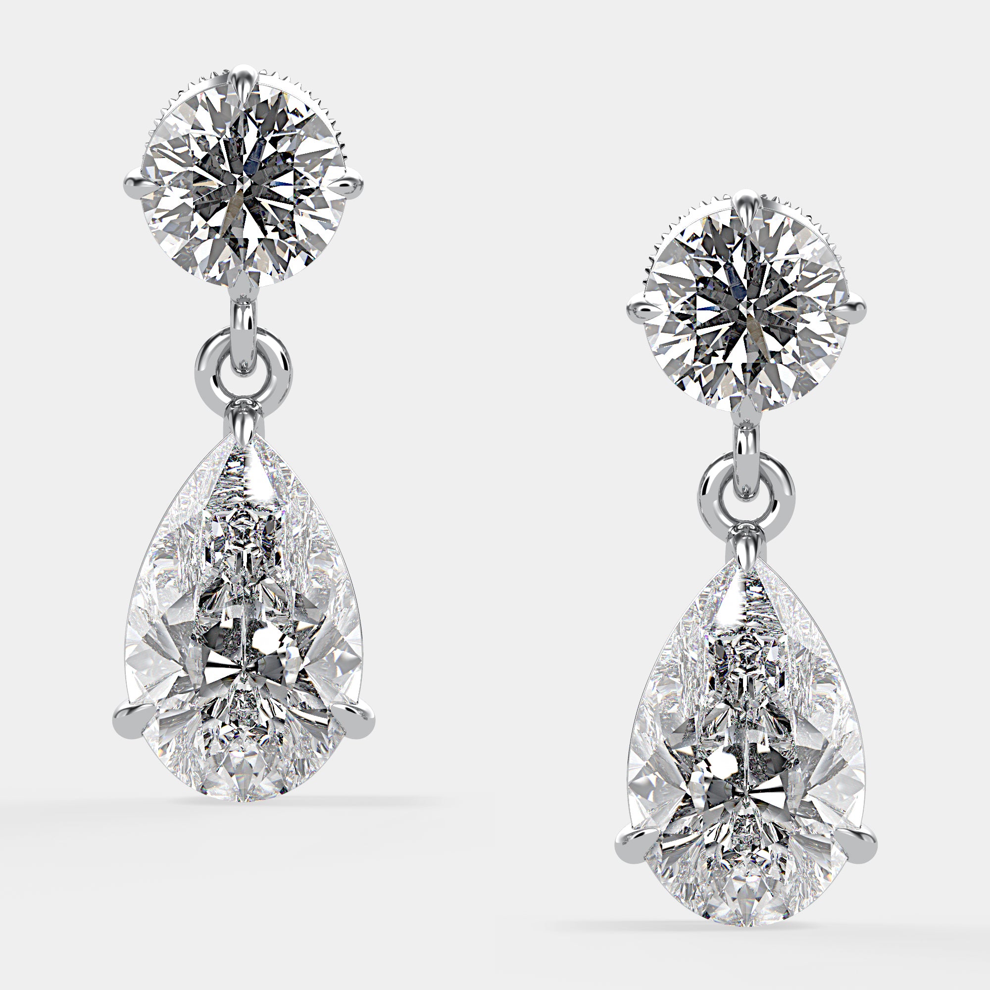 Front view of Bougie Baby Duo Diamond Drop Earrings in white gold with brilliant and pear-cut diamonds