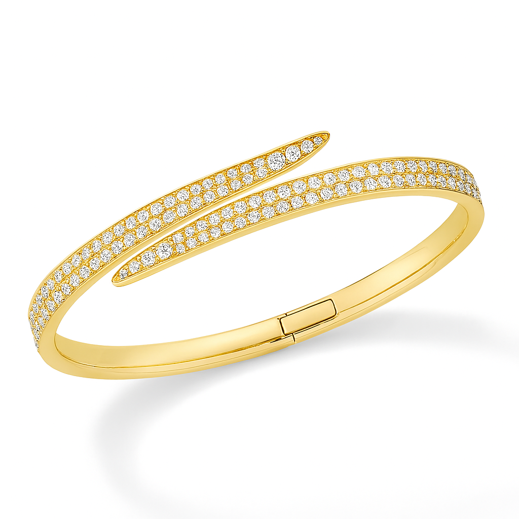 Yellow gold Bypass the Rules diamond bangle shown from a diagonal angle, revealing inner curve and pavé diamond swirl.