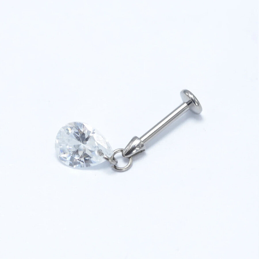 Cleo's Lucky Ear Charm flat lay, elegant floating charm ideal for earring stack styling