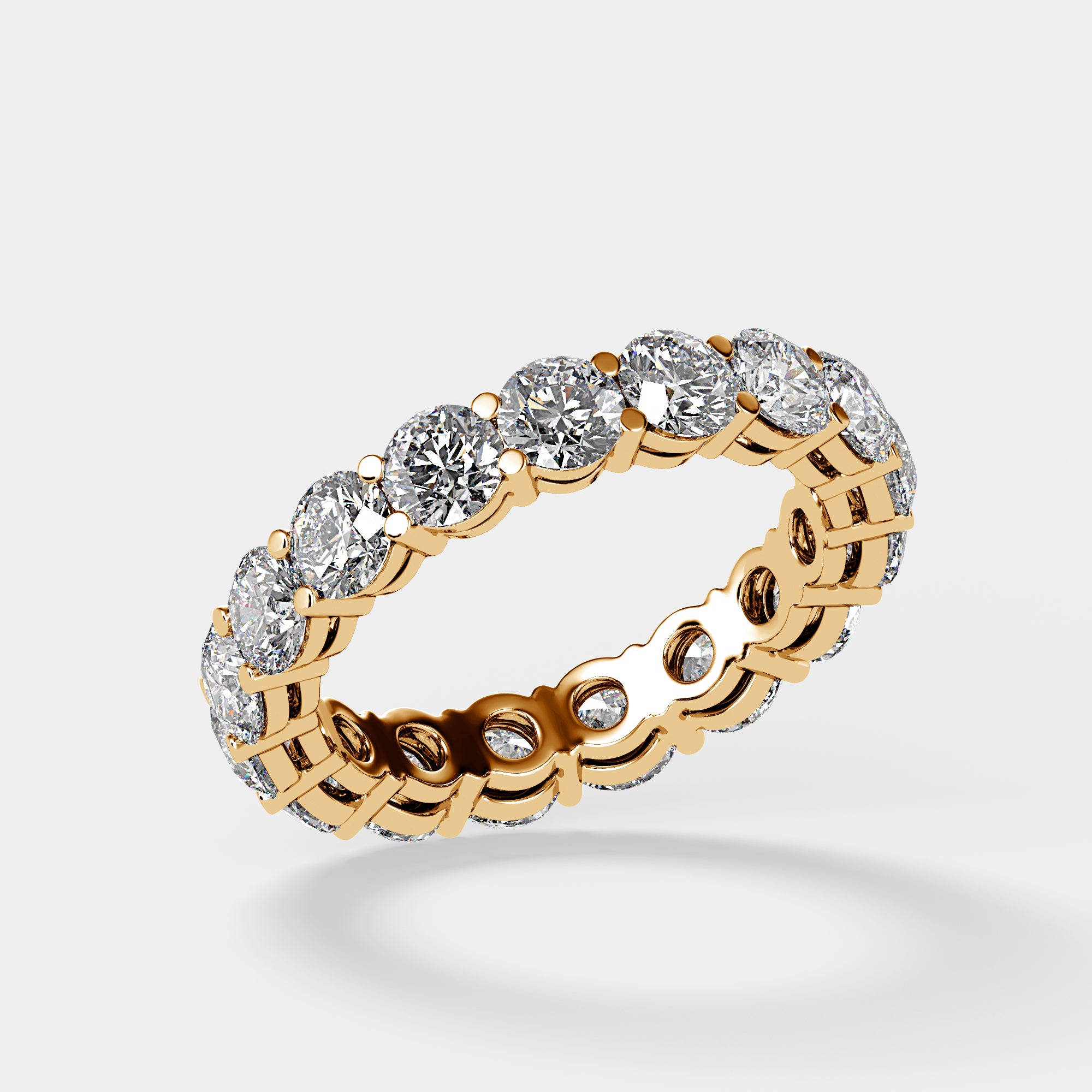 Angled view of yellow gold lab-grown diamond eternity band