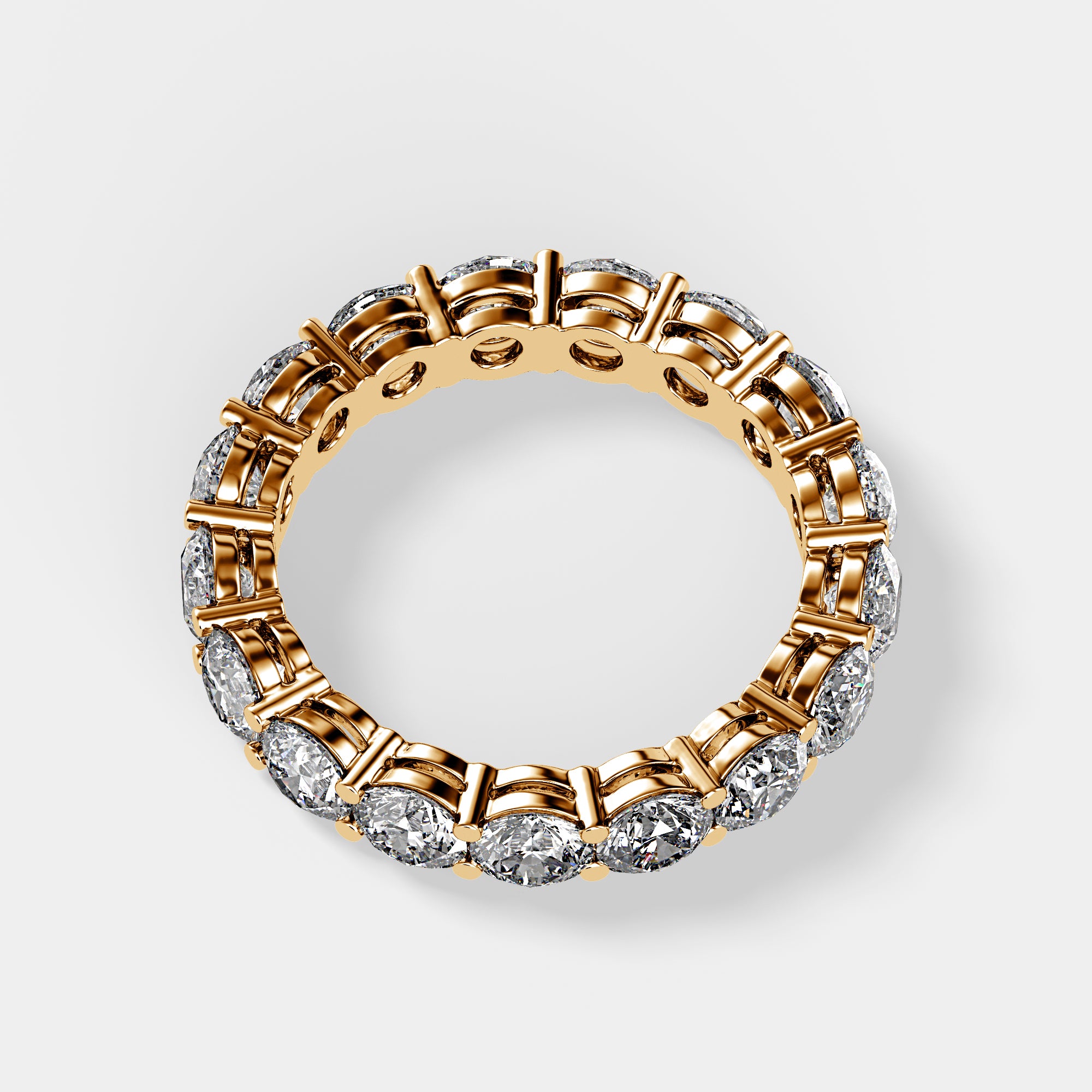Flat-lay top view of yellow gold eternity band with lab-grown diamonds