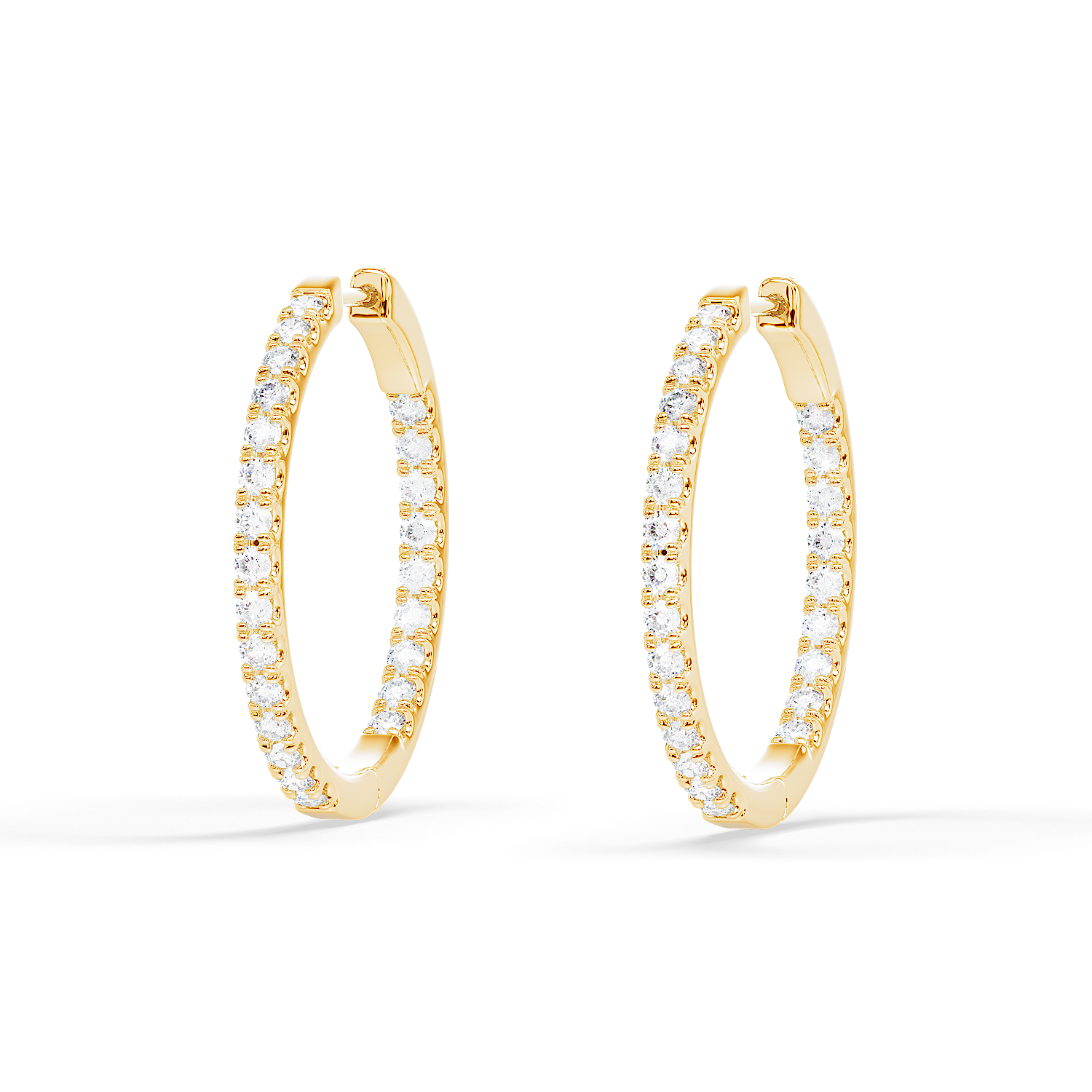 Front view of Hug Me Hoops diamond inside-out hoop earrings in yellow gold