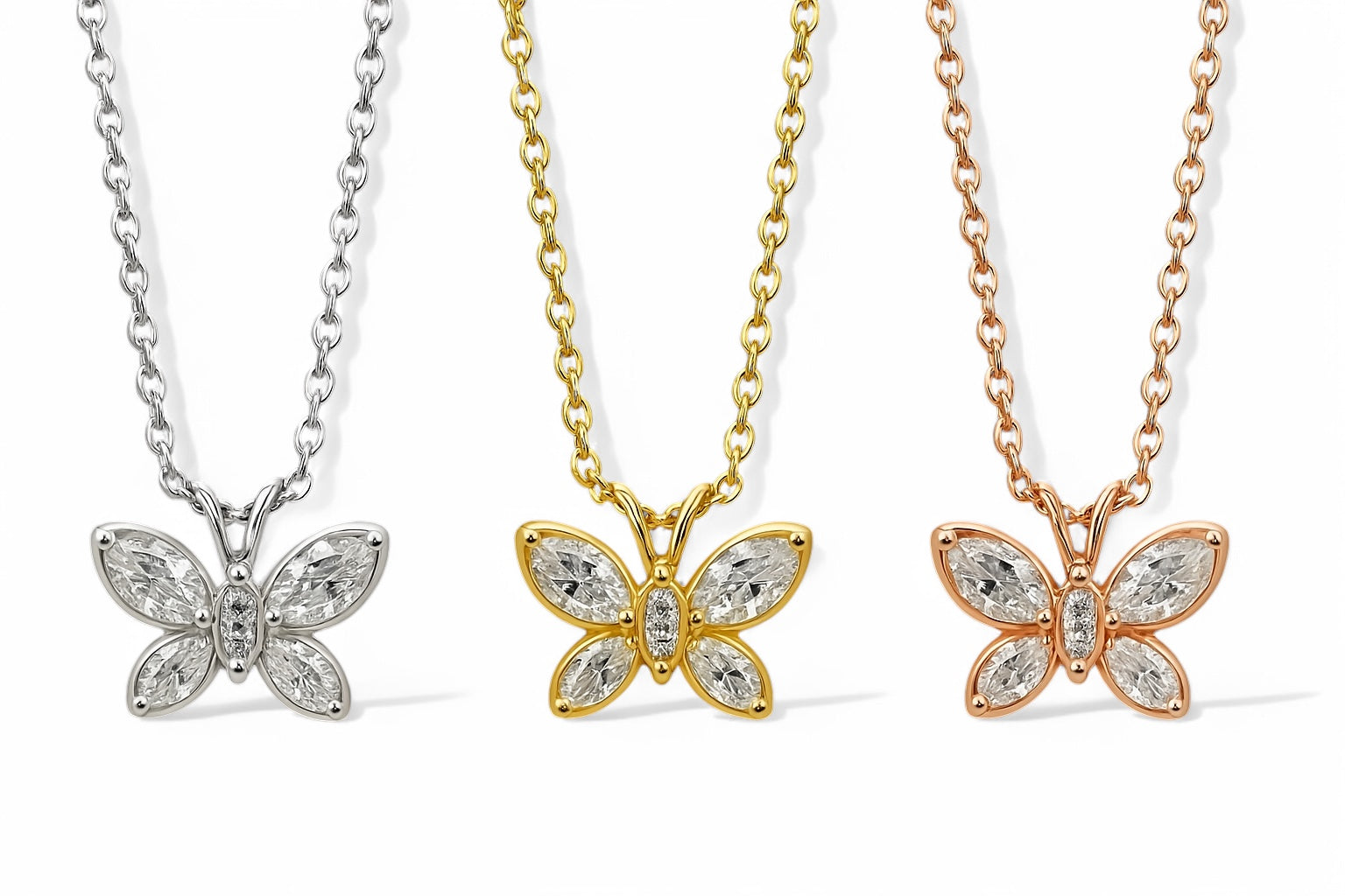 Side-by-side image of Jasmine's Butterfly Pendants in yellow, white, and rose gold with diamond details on display
