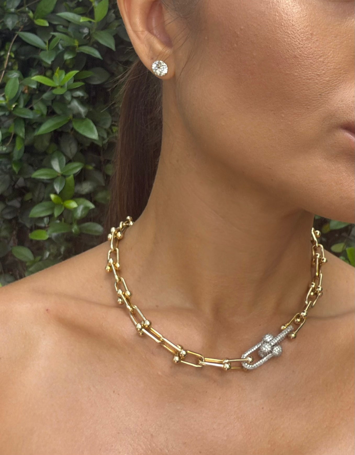 Link Me Chain 18k gold necklace with pavé diamonds shown on model, bold sculptural link design, statement jewelry piece.