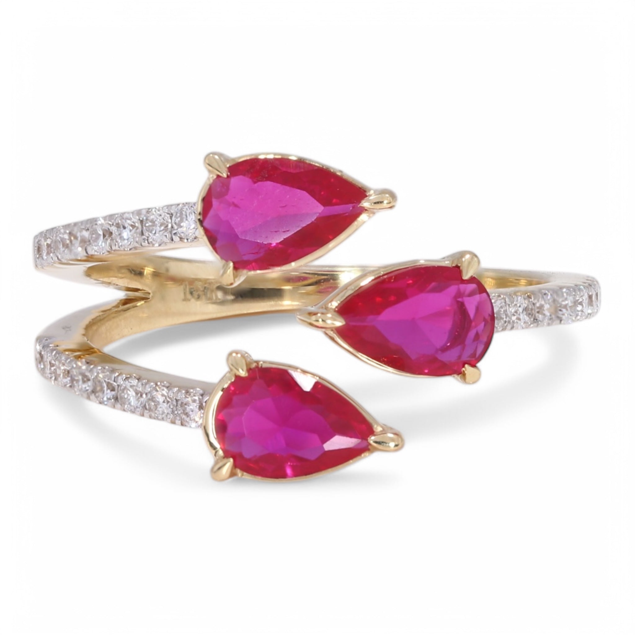 Ménage à Trois Ring with ruby pear-shaped center stones in yellow gold, front view