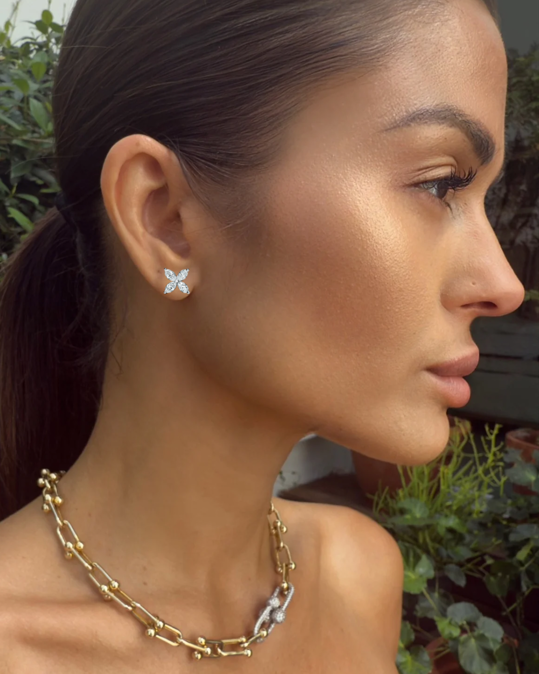Model wearing white gold Night Blooming Jasmine diamond studs with radiant floral elegance