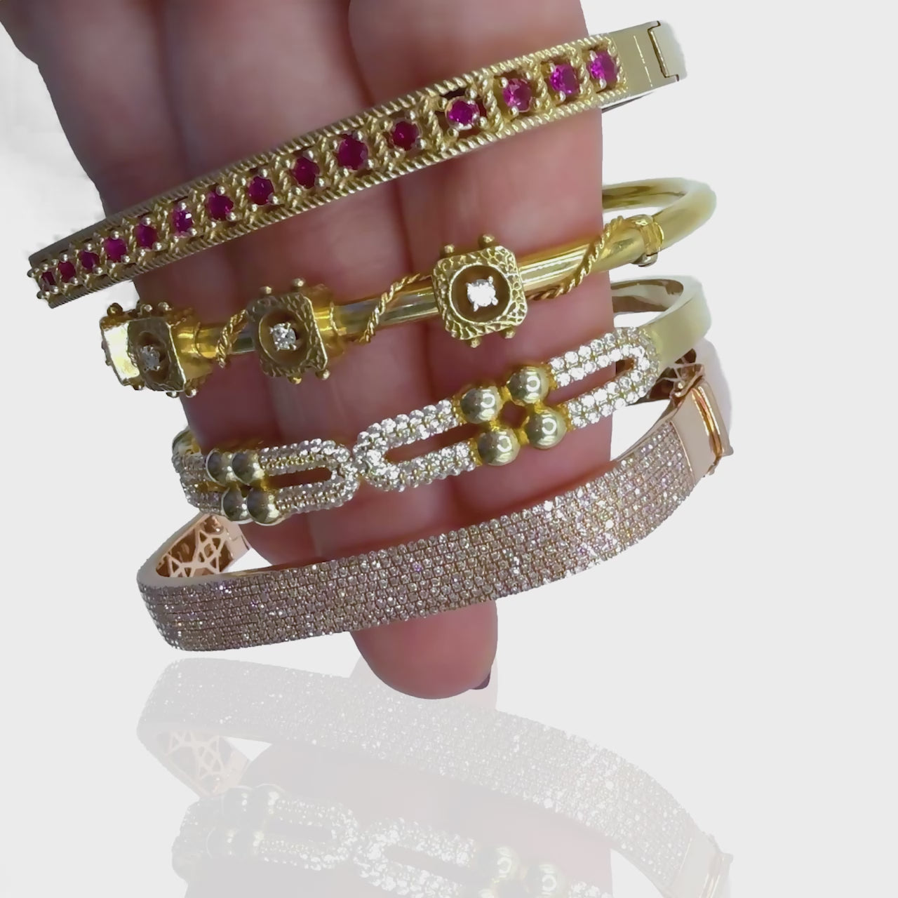 Video of hand modeling Tied Up Antique Italian Bangle with a layered gold bracelet stack