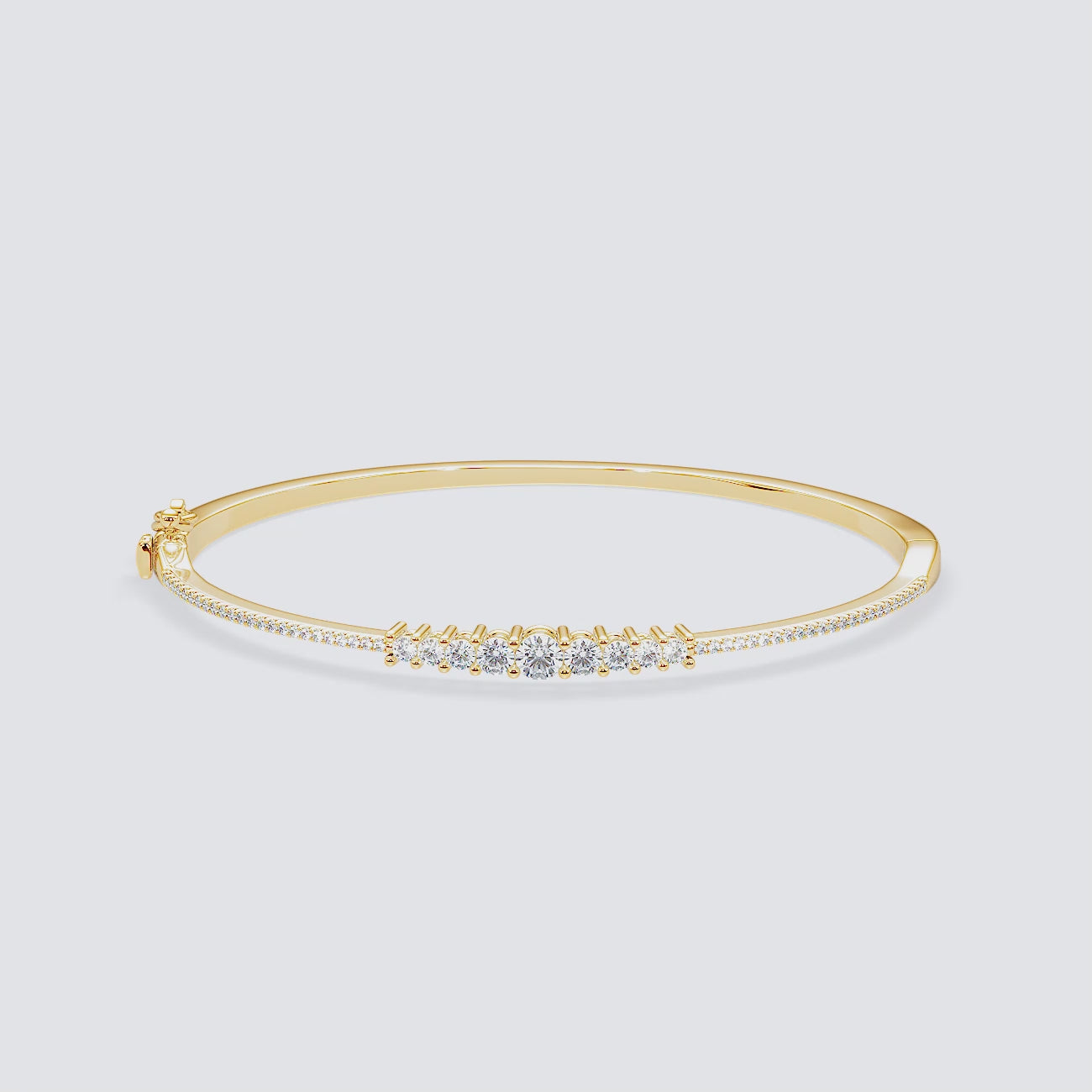 360-degree video of Less is More diamond bangle in 14k yellow gold, highlighting full-round graduated diamond design.