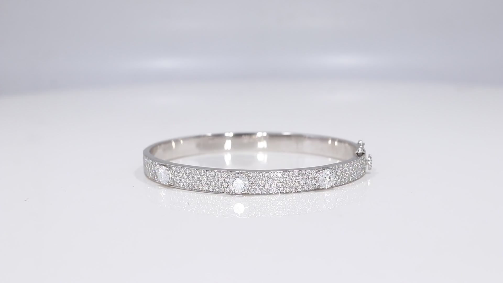 360-degree video of Triple Threat Pavé Bangle in white gold highlighting pavé detail and central diamonds