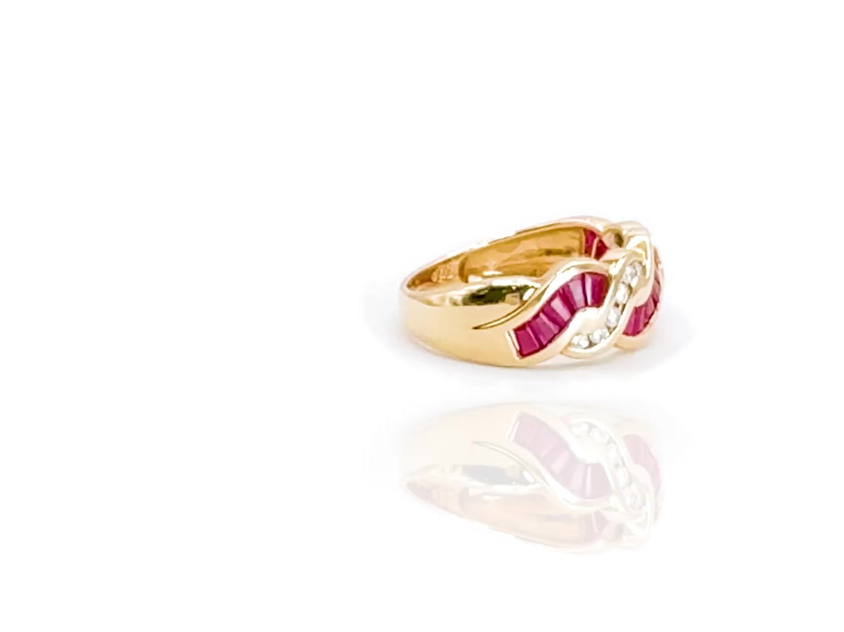 360-degree video of Just a Fling ruby and diamond ring in yellow gold highlighting curves and color contrast