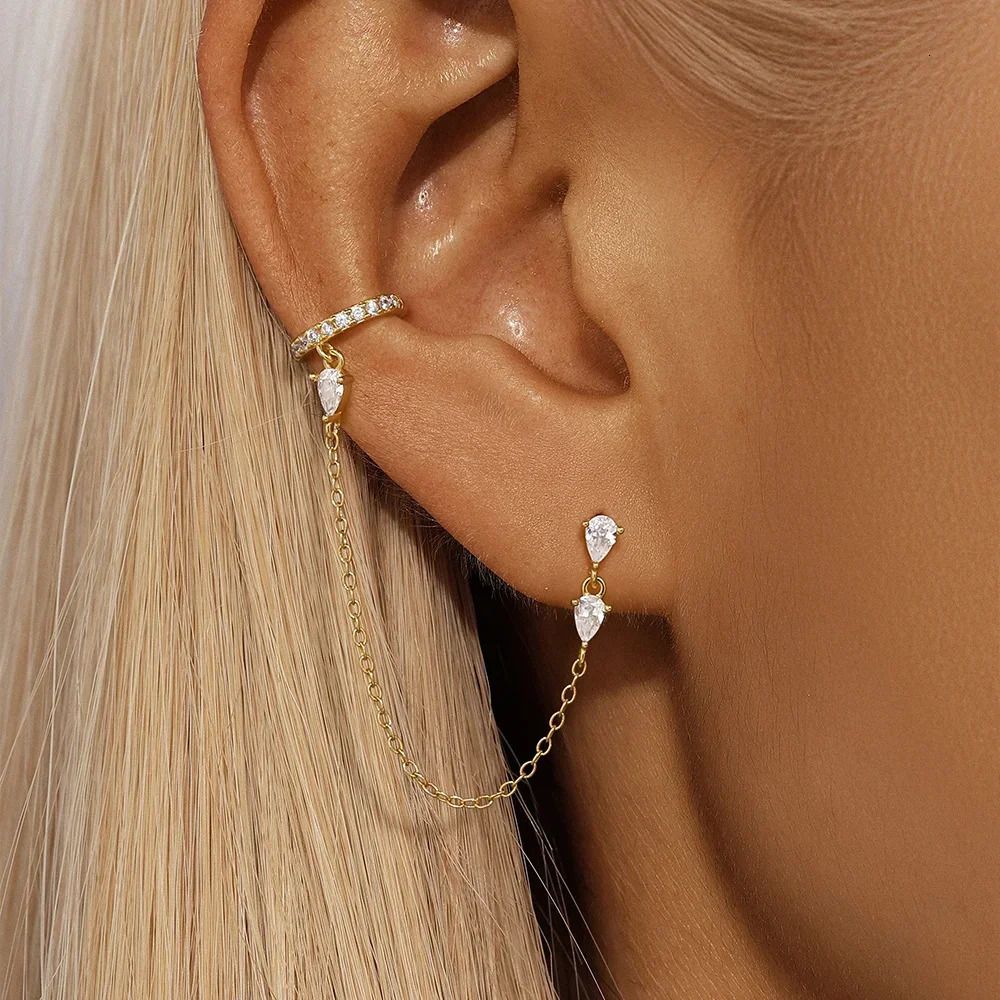 Editorial photo of model wearing Side Piece Triple Pear Diamond Cuff earring styled with other pieces