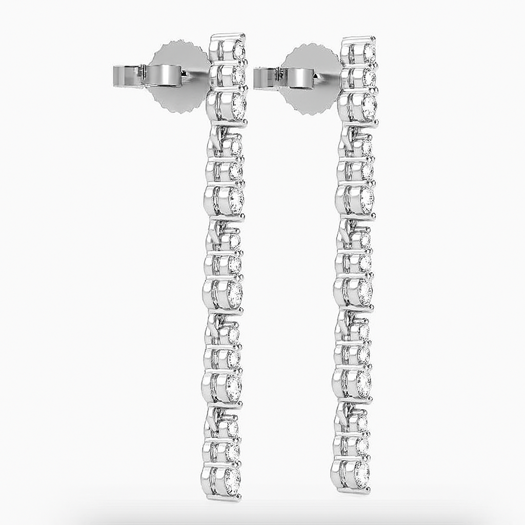 Right side view of white gold Skinny Dips earrings showing earring back and slim diamond drop