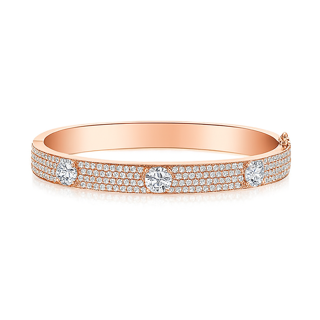 Front view of Triple Threat Pavé Bangle in 14k rose gold with three round diamonds and pavé detail