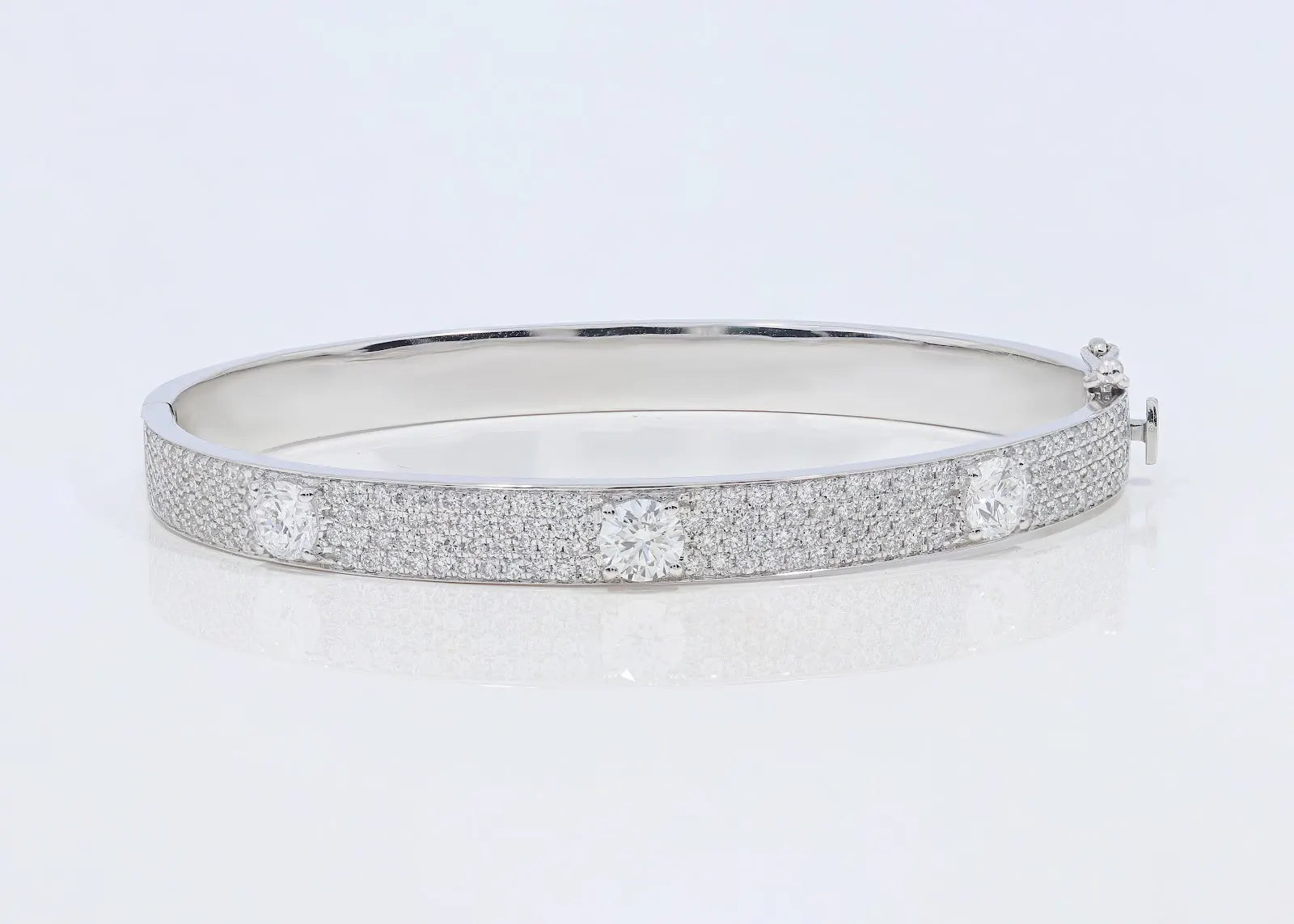 Front view of Triple Threat Pavé Bangle in 14k white gold with signature three-diamond and pavé design