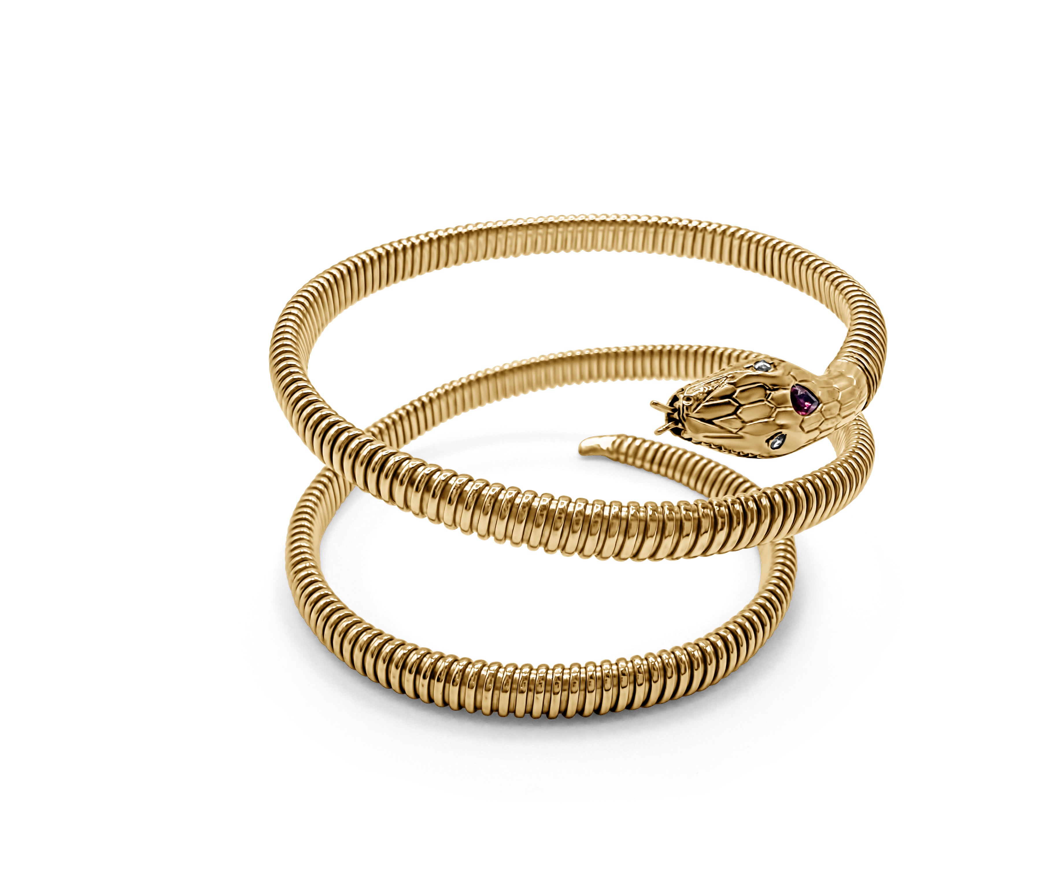 Top view of snake-shaped bangle in 14k yellow gold, coiled design with ruby and diamond head detailing
