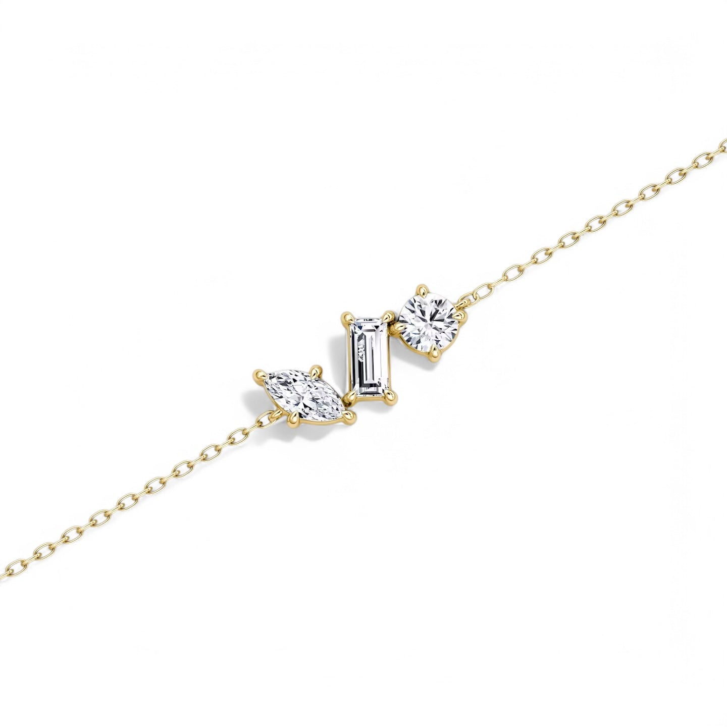 Detail view of The Wish Chain Diamond Bracelet in 14k yellow gold featuring mixed diamond cuts – round, marquise, and baguette