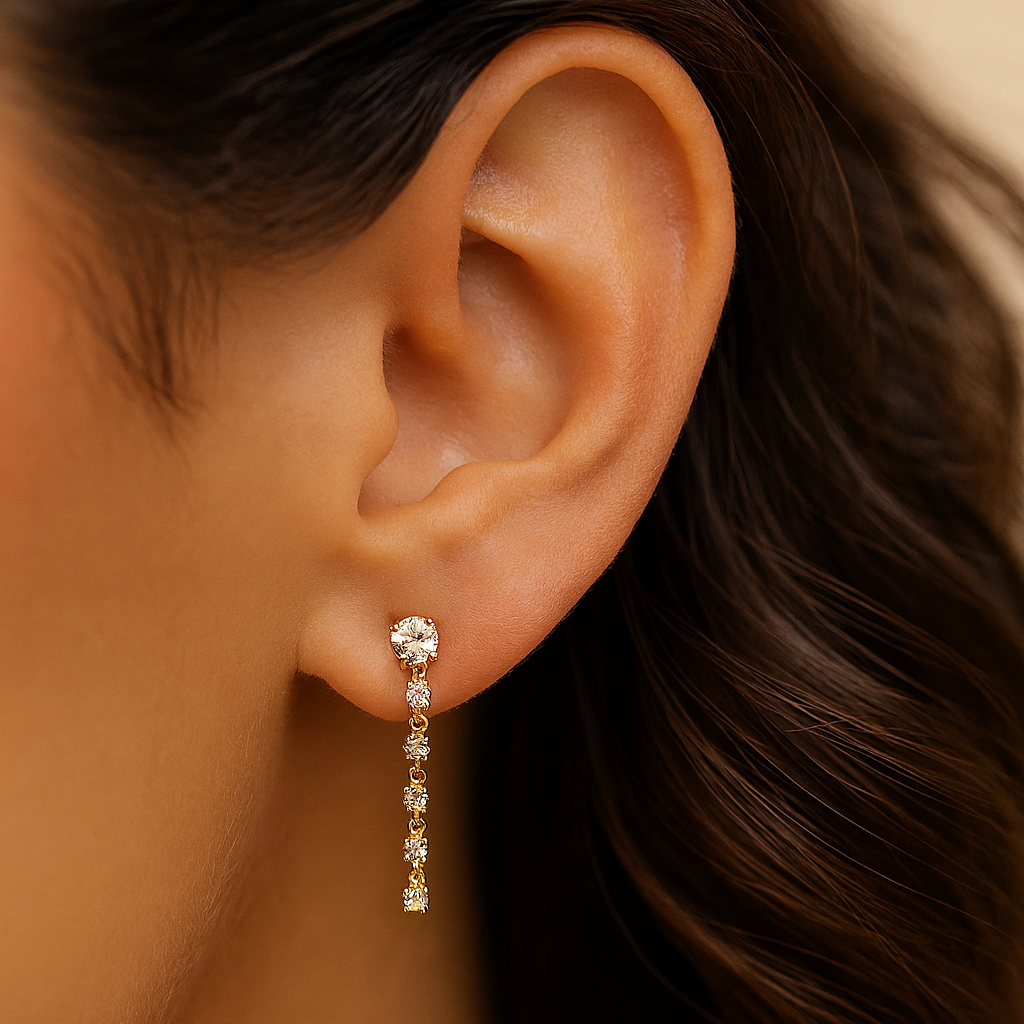 11:11 Line Drop Earring in yellow gold worn on ear, diamond linear design
