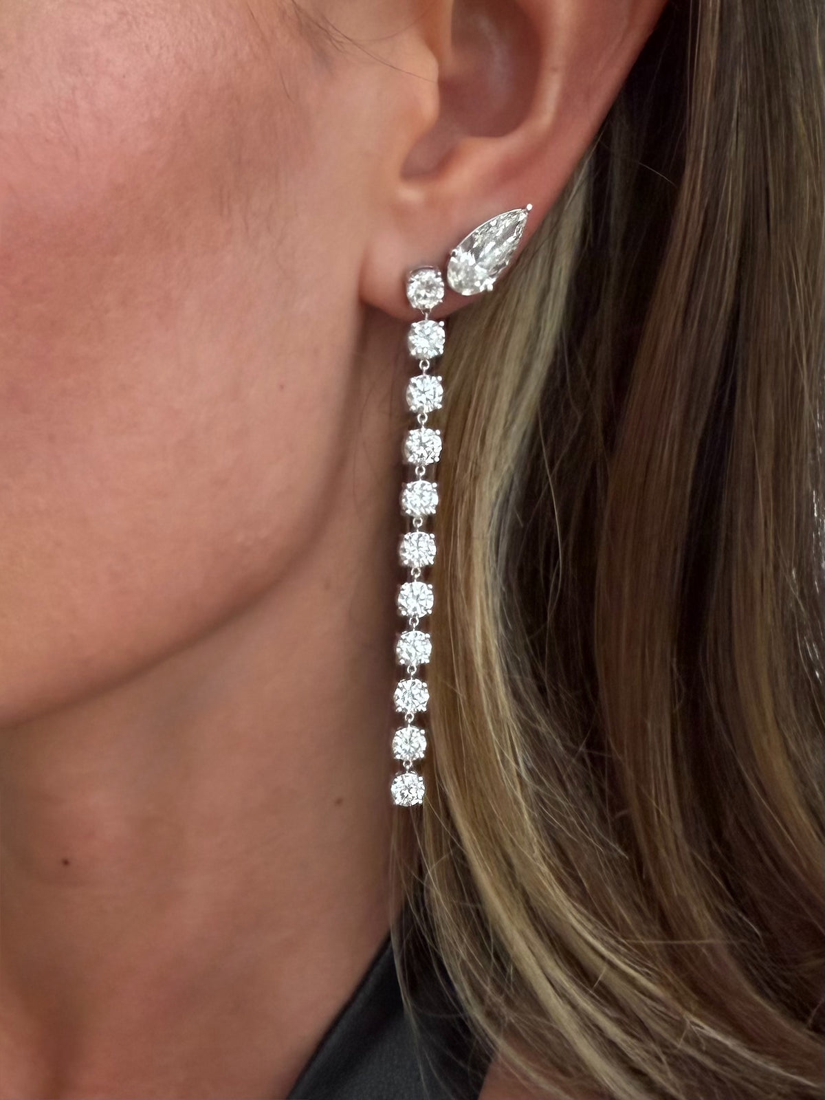 11:11 Diamond Drop Earrings featuring 10.3 carats of linear drop diamond earrings in yellow gold styled on ear — Waltz Diamonds