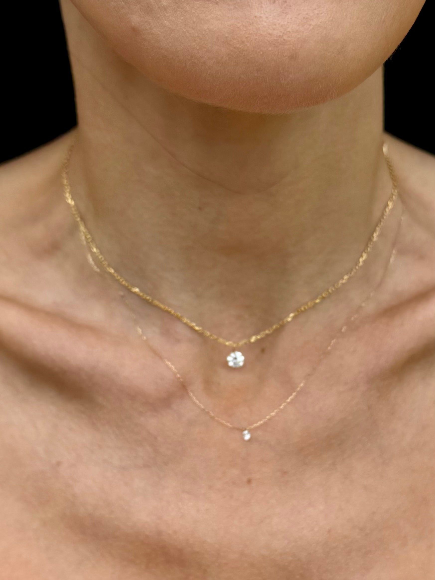 The Adora Daphne floating diamond necklace shown on model in yellow gold