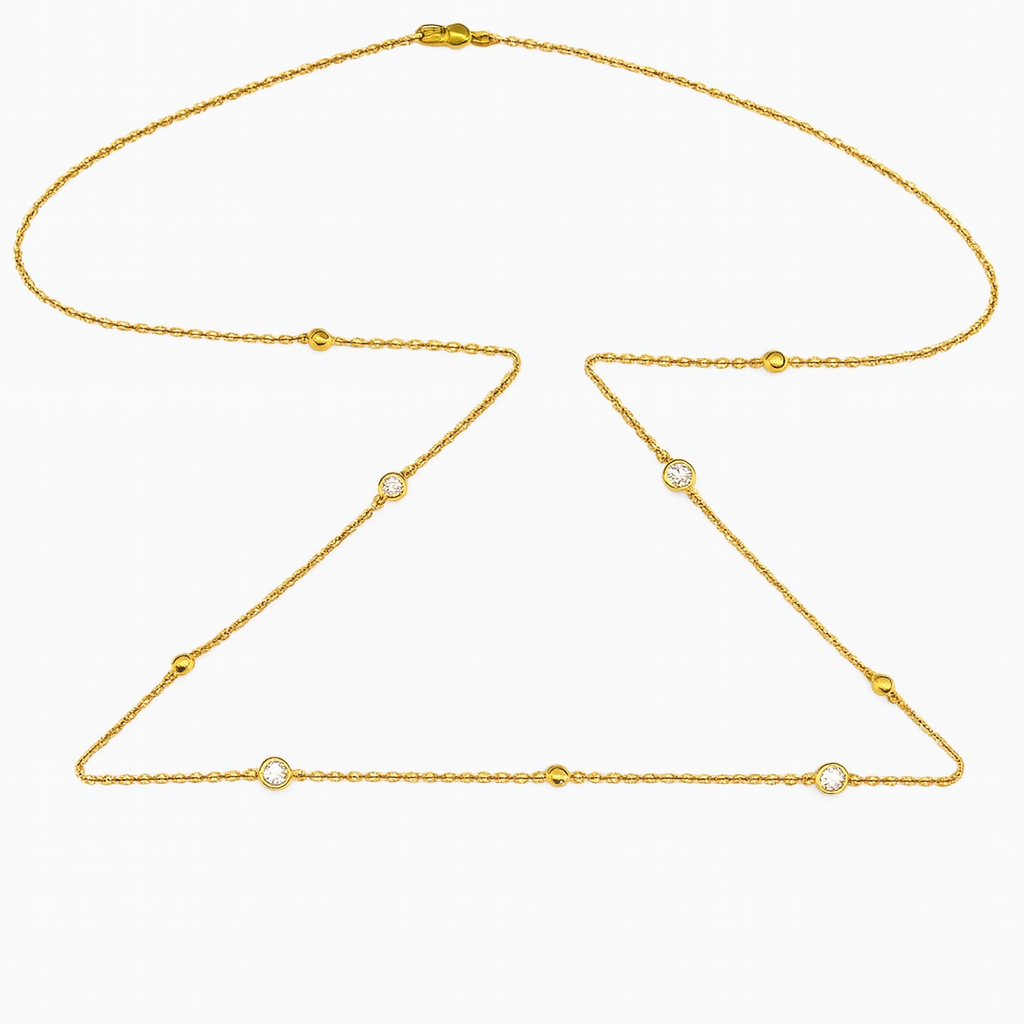Gold belly chain with lab diamonds on a white background