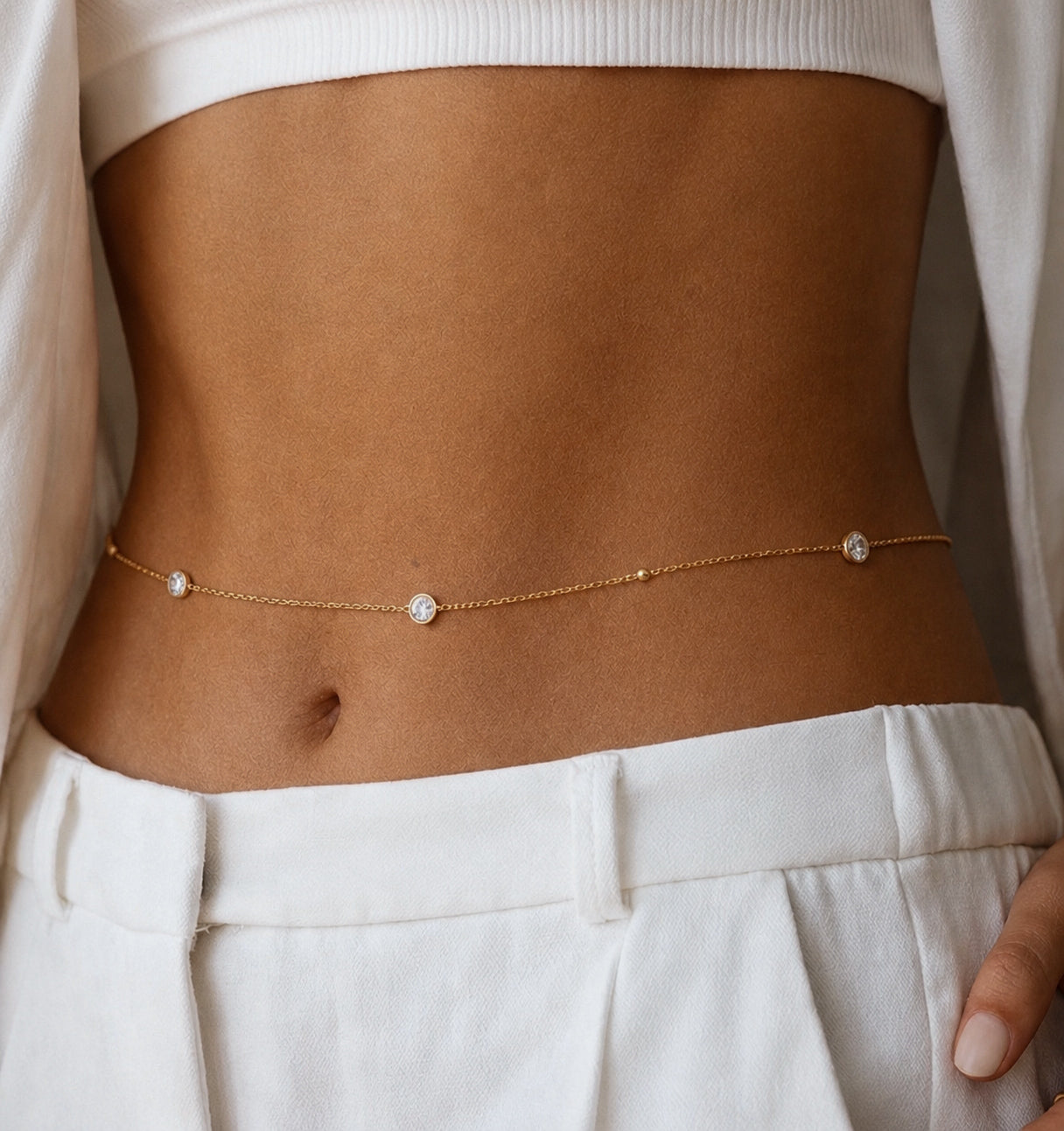 Athenas bellydance chain with bezeled diamonds around yellow gold on model — Waltz Diamonds