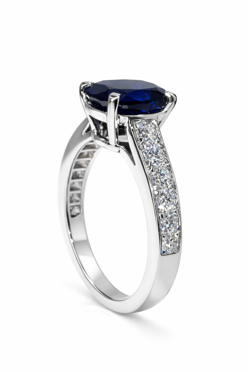 The Blue Nilu cushion-cut sapphire ring with diamonds and platinum side view—Waltz Diamonds