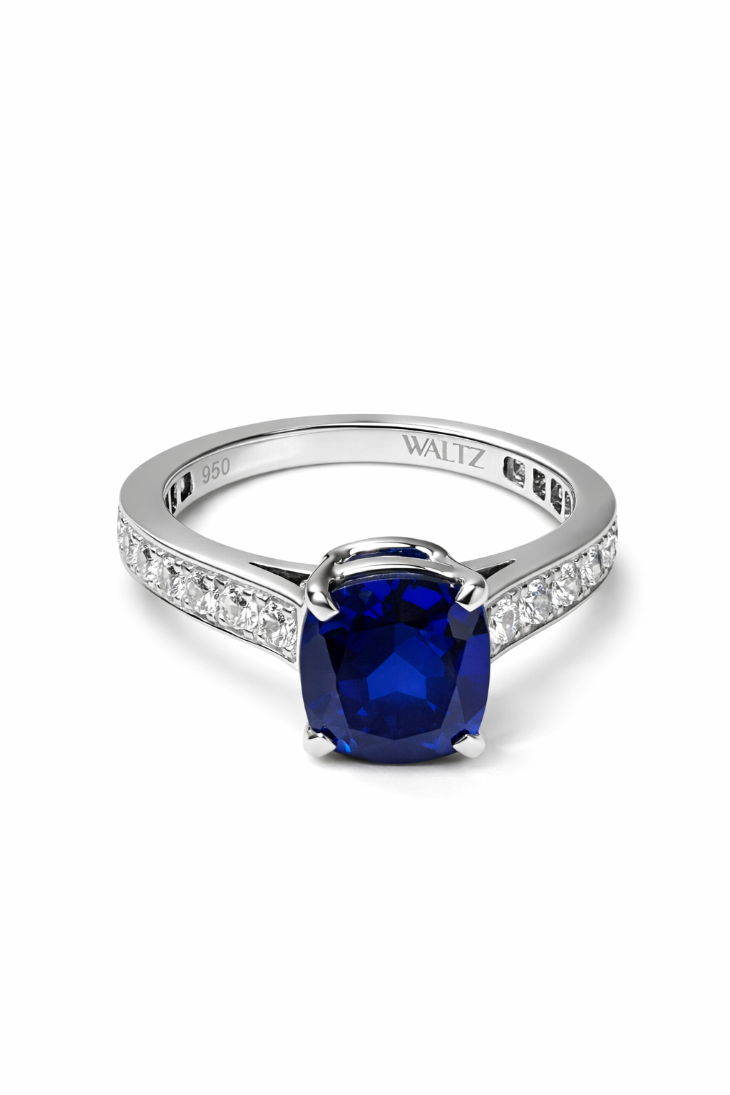 Blue Niu sapphire cushion-cut diamond ring in platinum laying flat—Waltz Diamonds