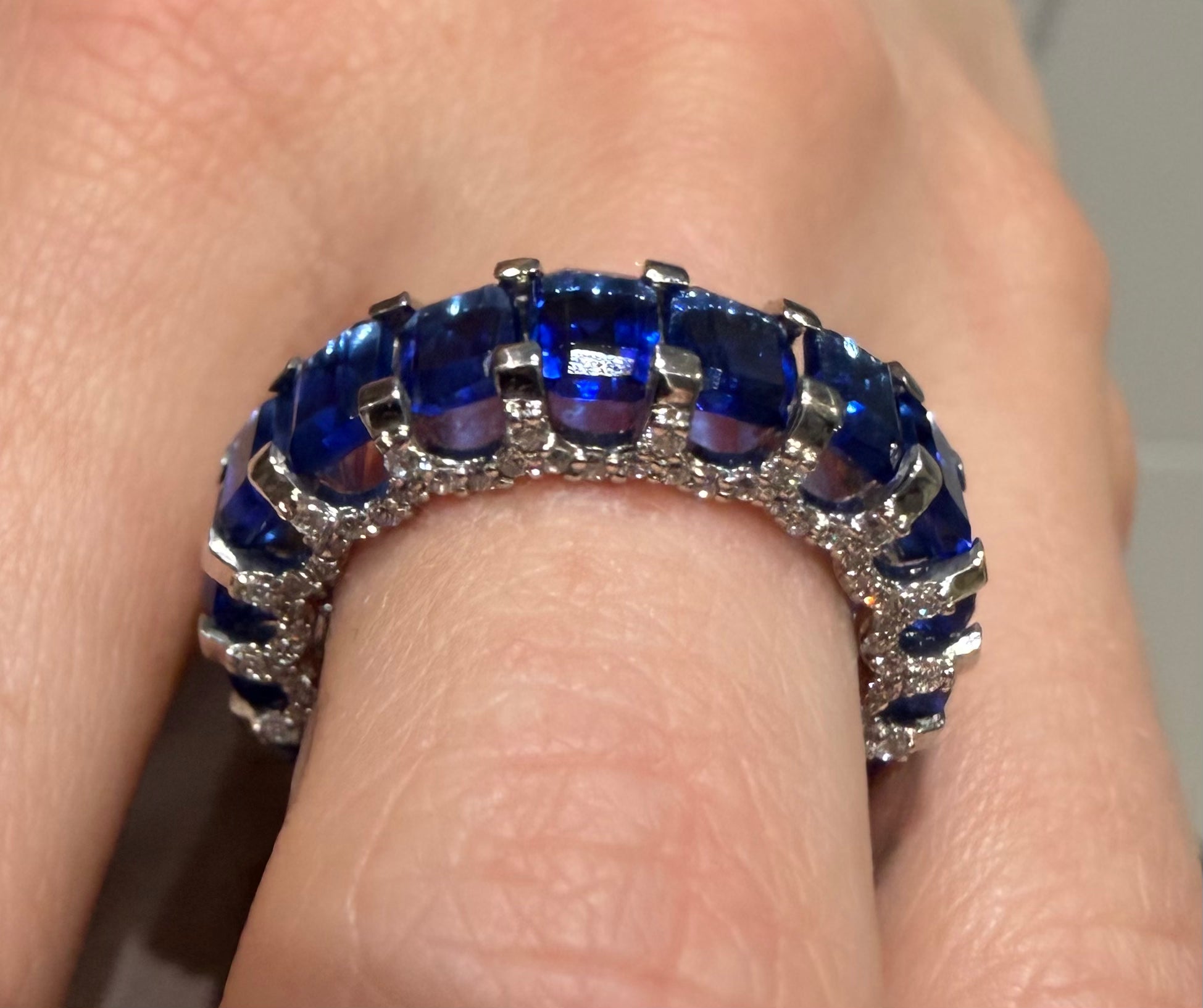 Blue blood sapphire eternity ring white gold on hand — Waltz Diamonds
