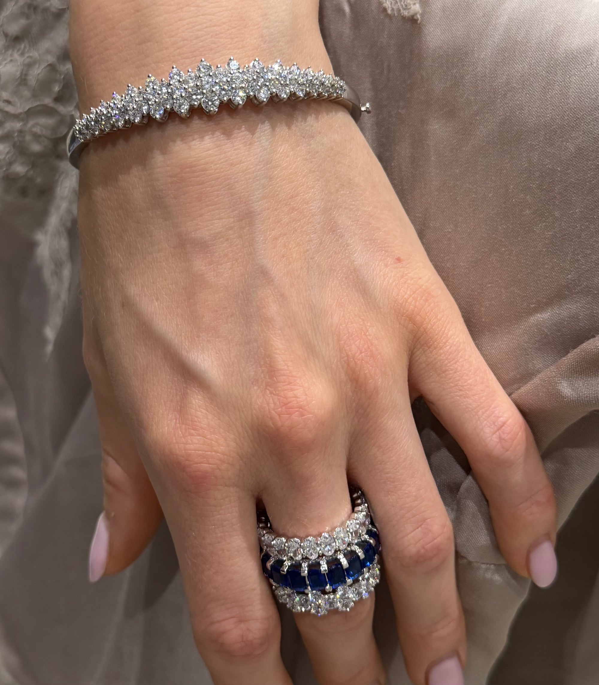 Blue blood sapphire eternity ring styled with other Waltz Jewelry — Waltz Diamonds