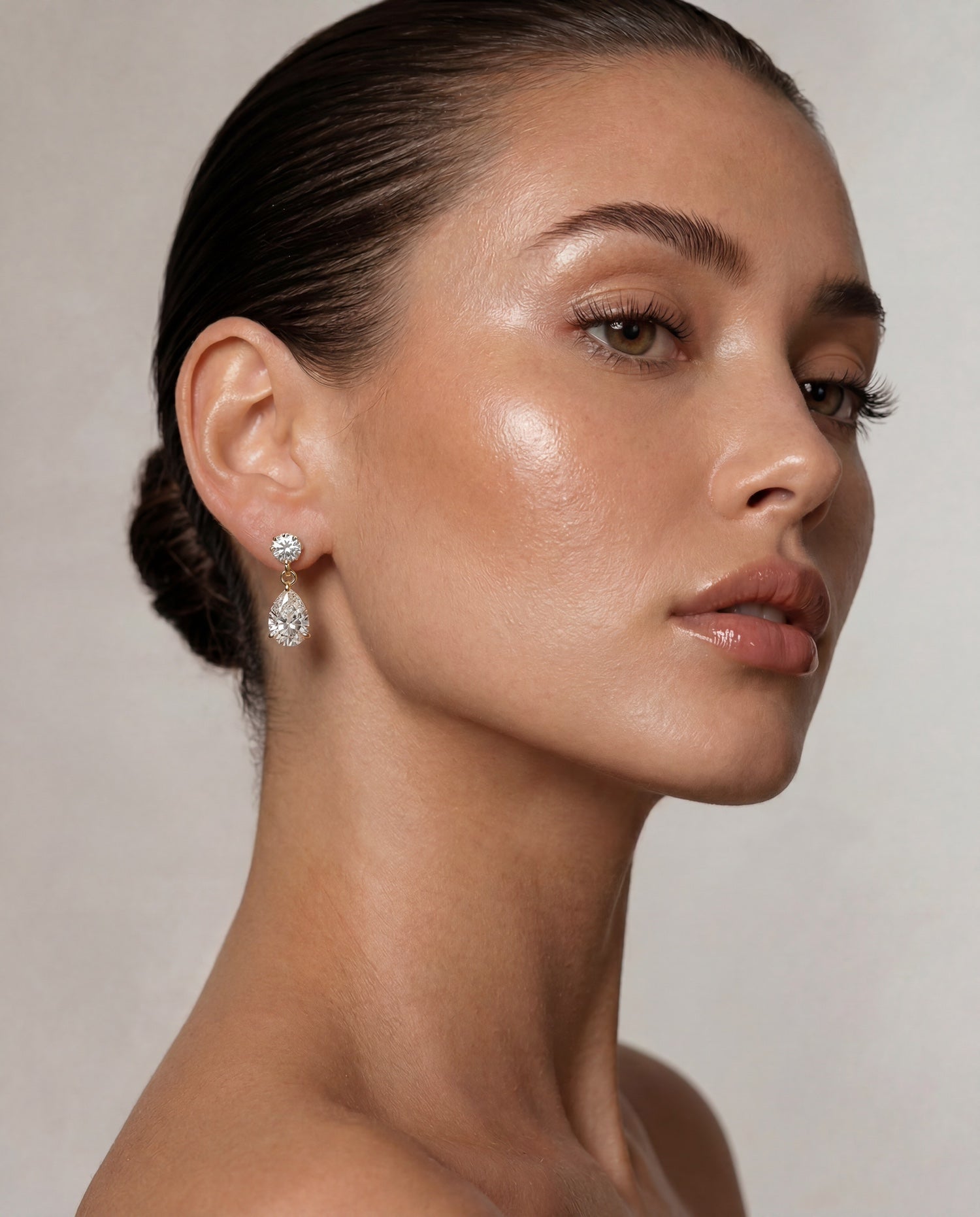 Bougie baby diamond drop earrings in six carats round with pear drop on model—Waltz Diamonds