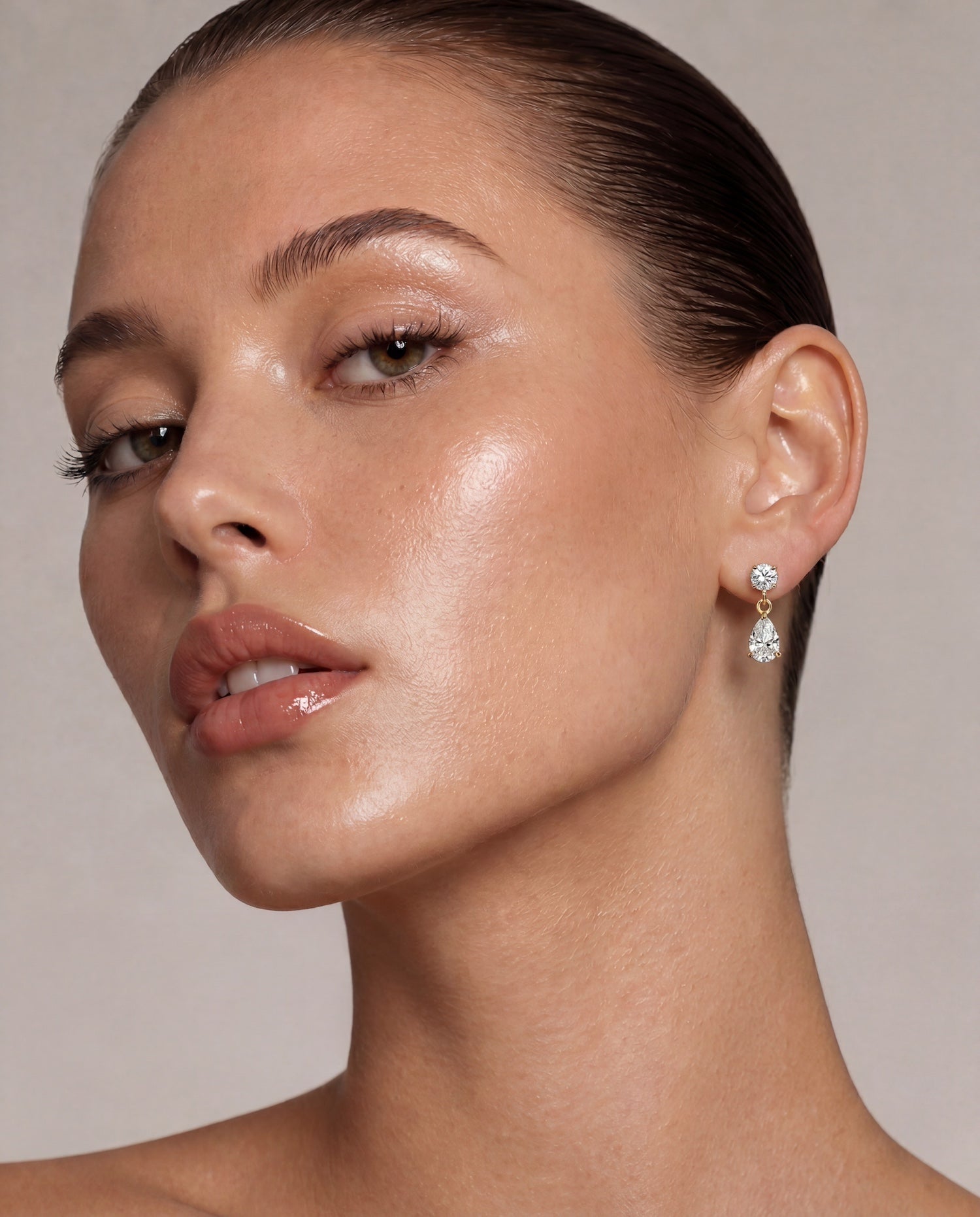 Bougie baby diamond drop earrings in three carats round with pear drop on model—Waltz Diamonds