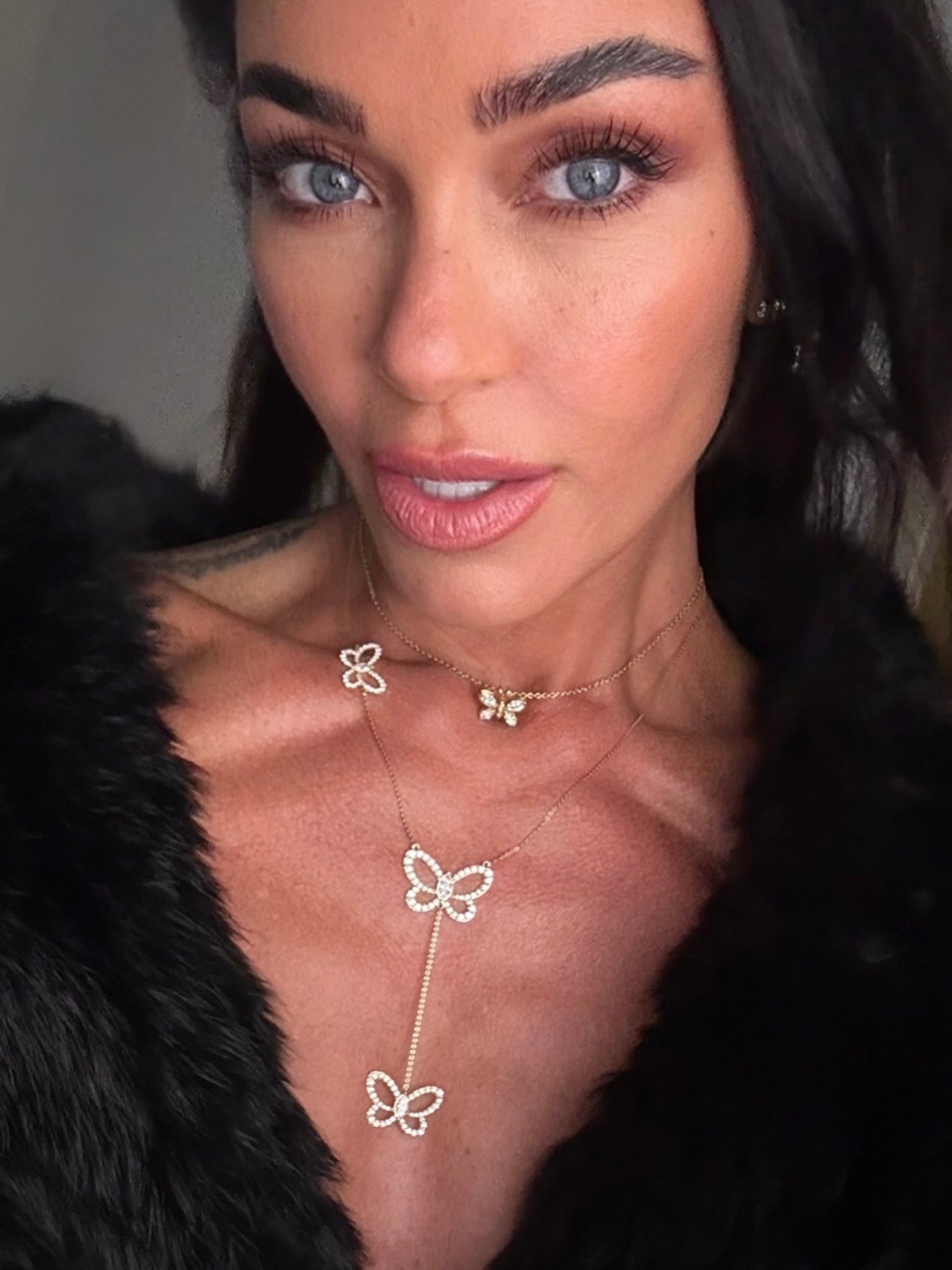 Butterfly Effect Lariat necklace with 3 suspended butterflies with marquise center stones in yellow gold  on model — Waltz Diamonds