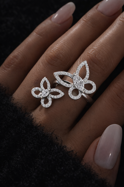 Butterfly Effect ring with floating pavé butterflies and marquise center stones white gold  on model — Waltz Diamonds