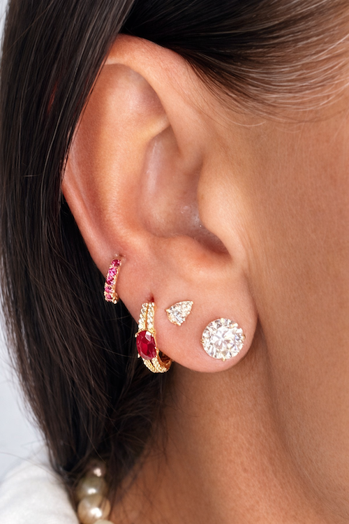 Color Pop Huggies in ruby and yellow gold styled on models ear — Waltz Diamonds