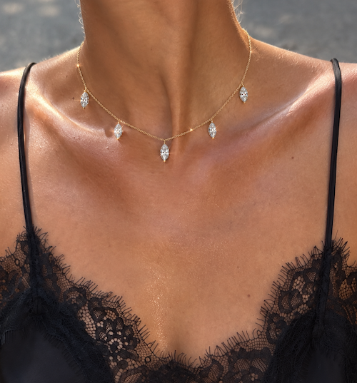 Dancing marquise diamond necklace featuring five marquise cut drop diamonds along yellow gold necklace on model — Waltz Diamonds