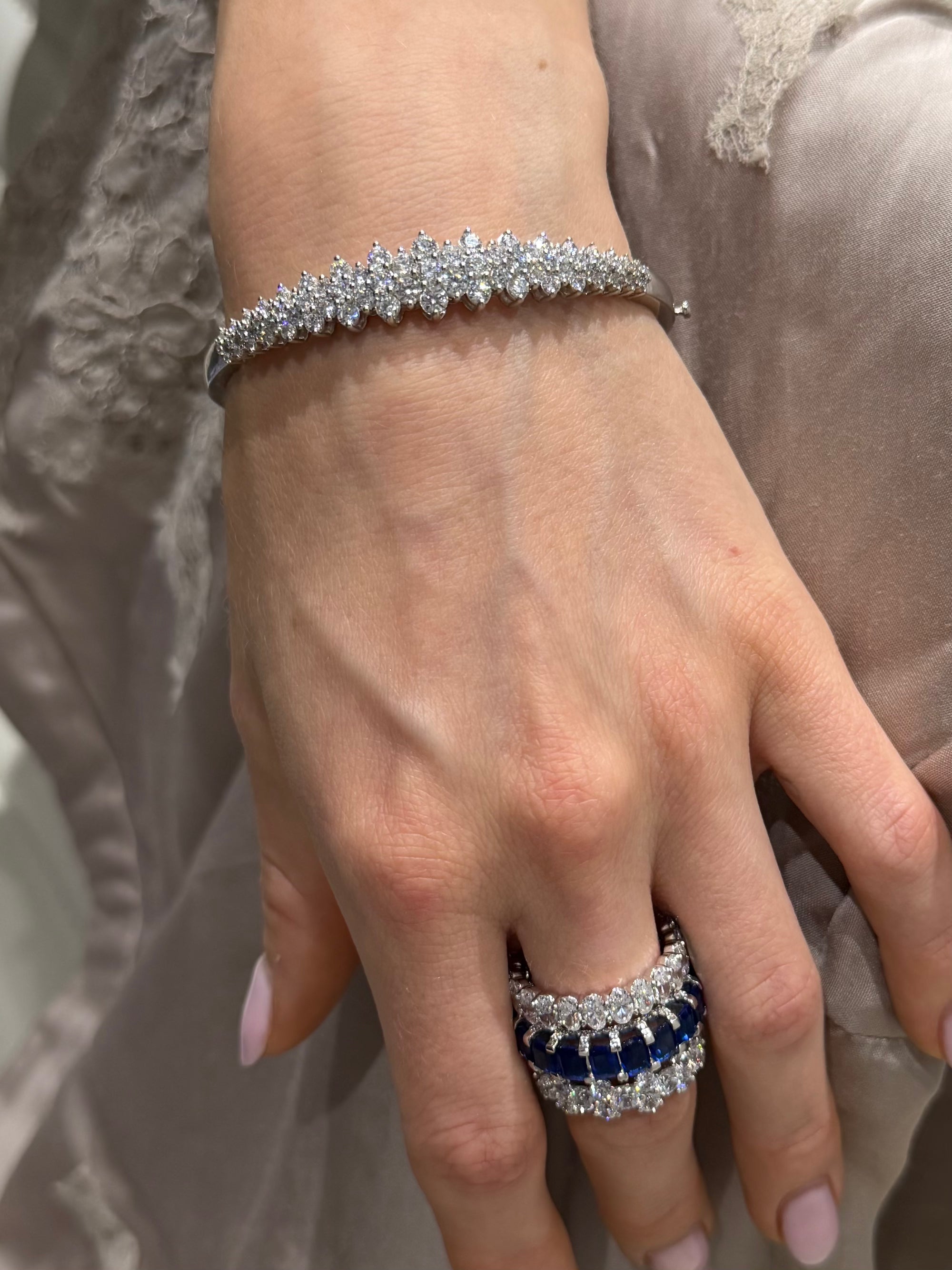 Darling Diamond cluster bangle in white gold styled on wrist — Waltz Diamonds
