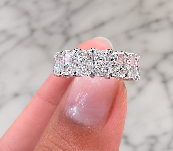 Eternal radiance band being held in white gold — Waltz Diamonds