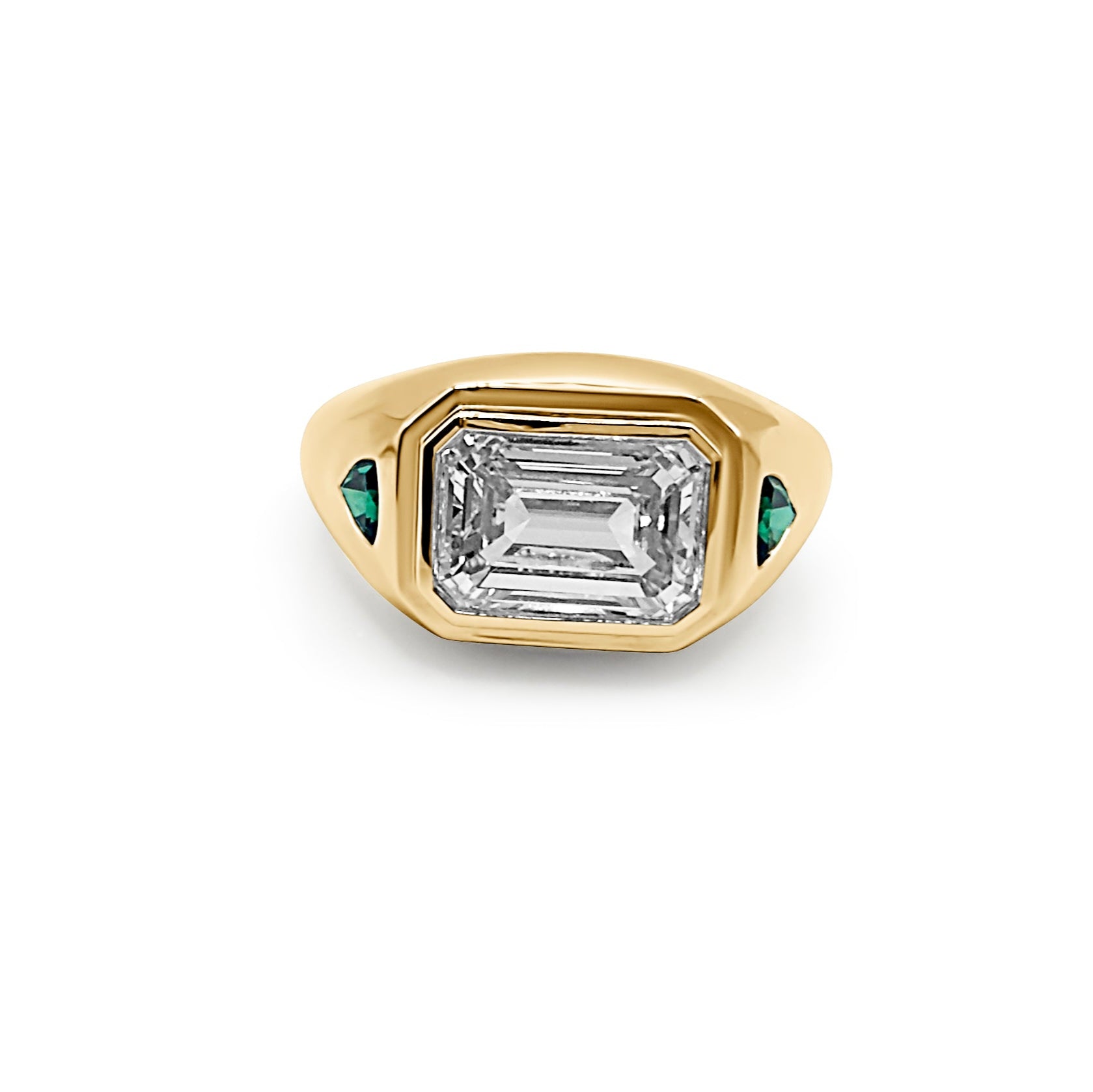 Femme forte 3 carat emerald cut yellow gold signet ring with green emerald side stones front view