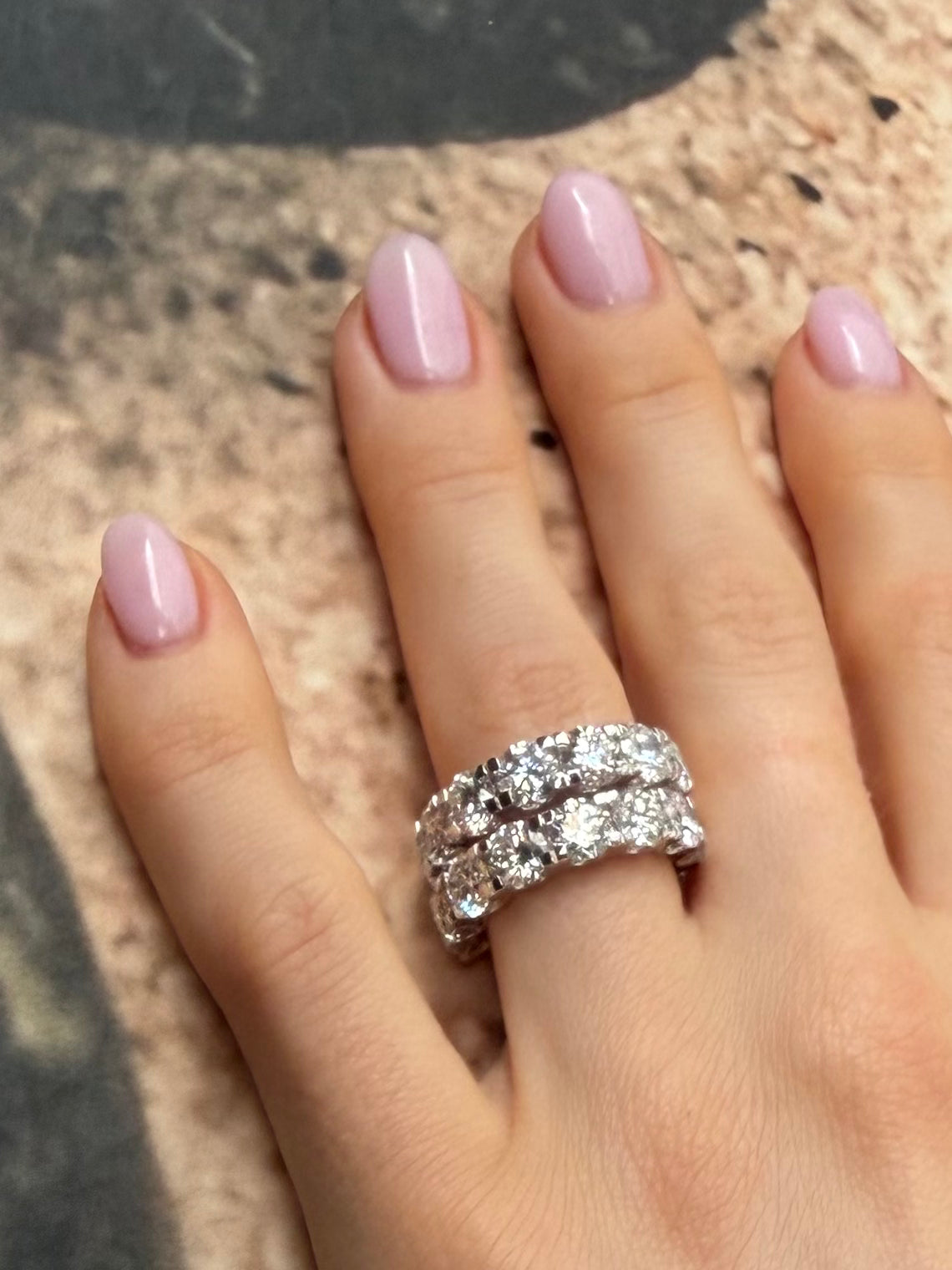 Gratuity band five carat eternity bands shown on hand—Waltz Diamonds