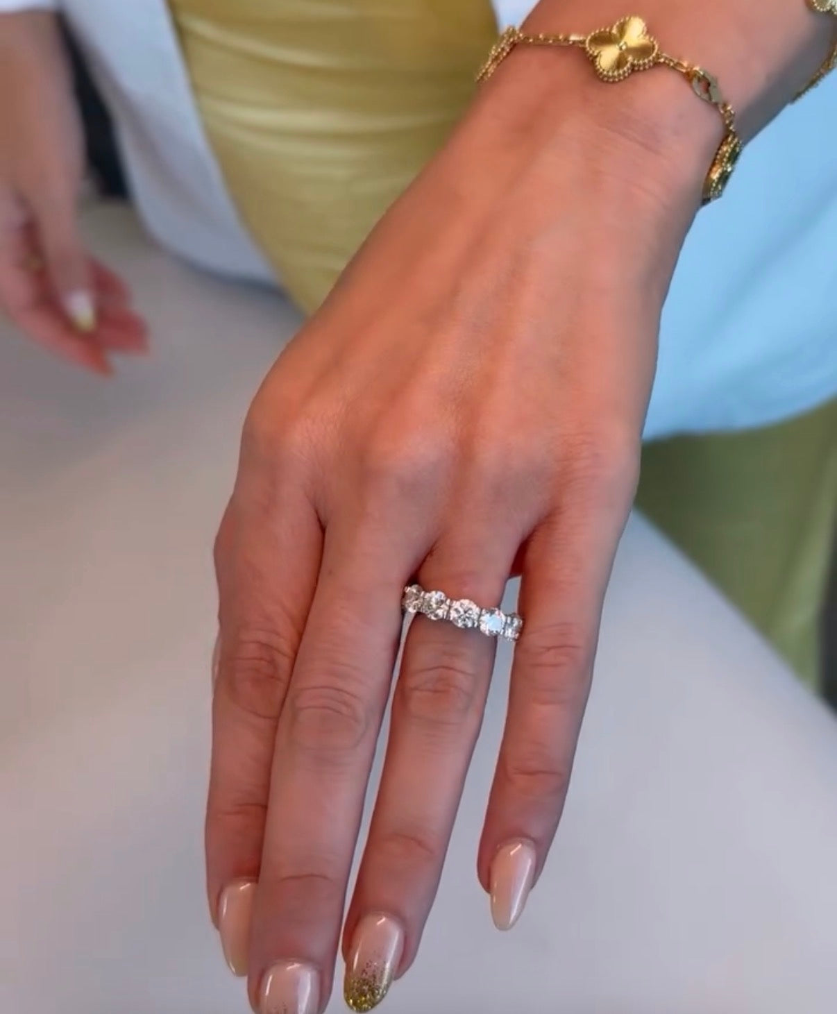 Gratuity band five carat eternity band shown on hand—Waltz Diamonds