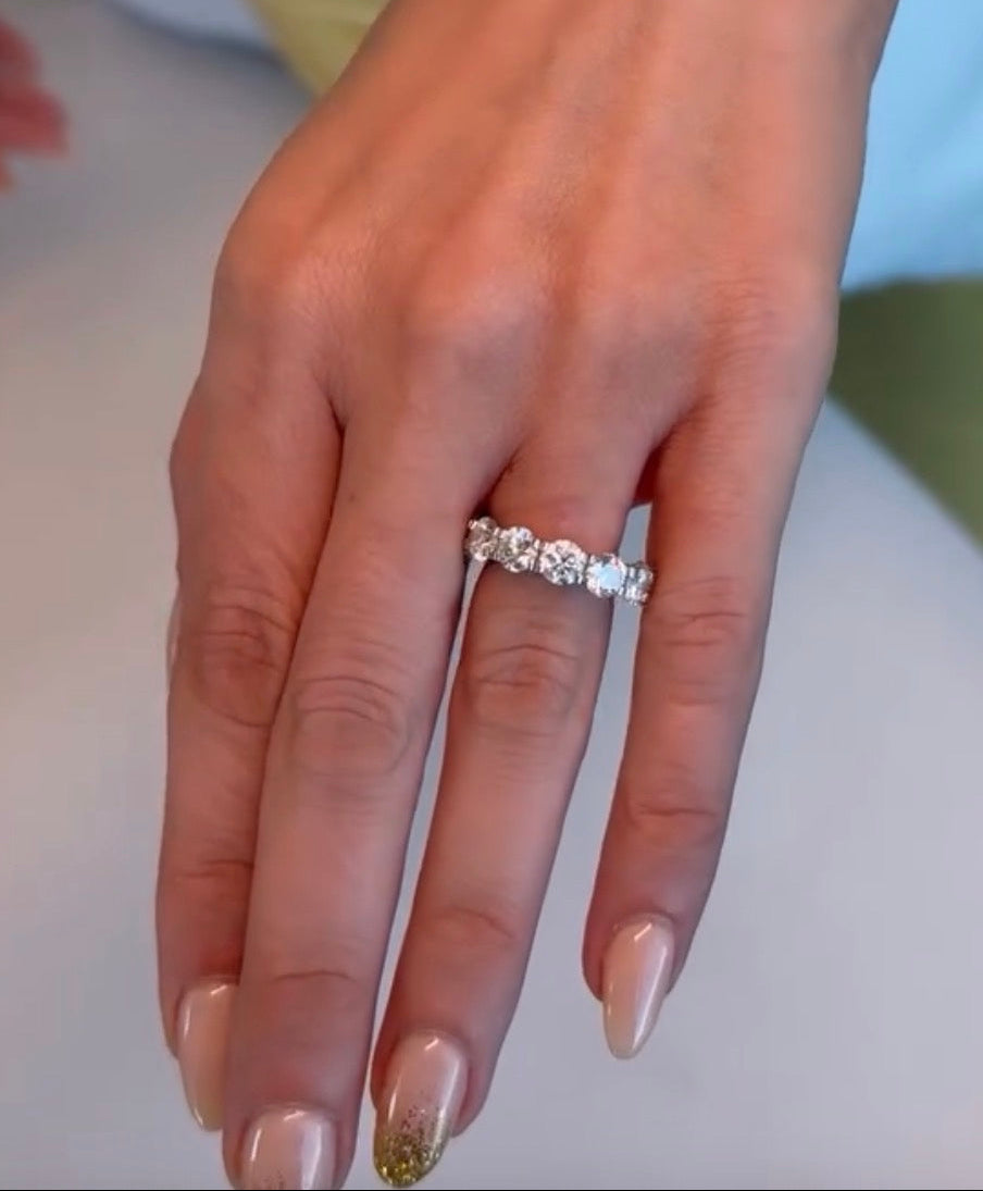 Gratuity band five carat eternity band shown on hand—Waltz Diamonds