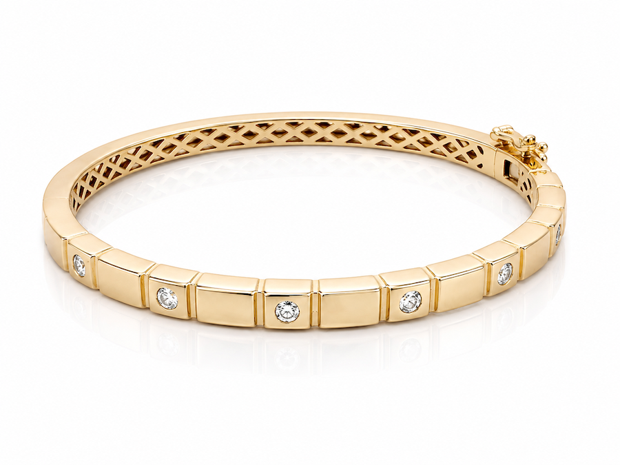 Groove Bangle features six bezel diamonds with a grooved design in yellow gold  — Waltz Diamonds