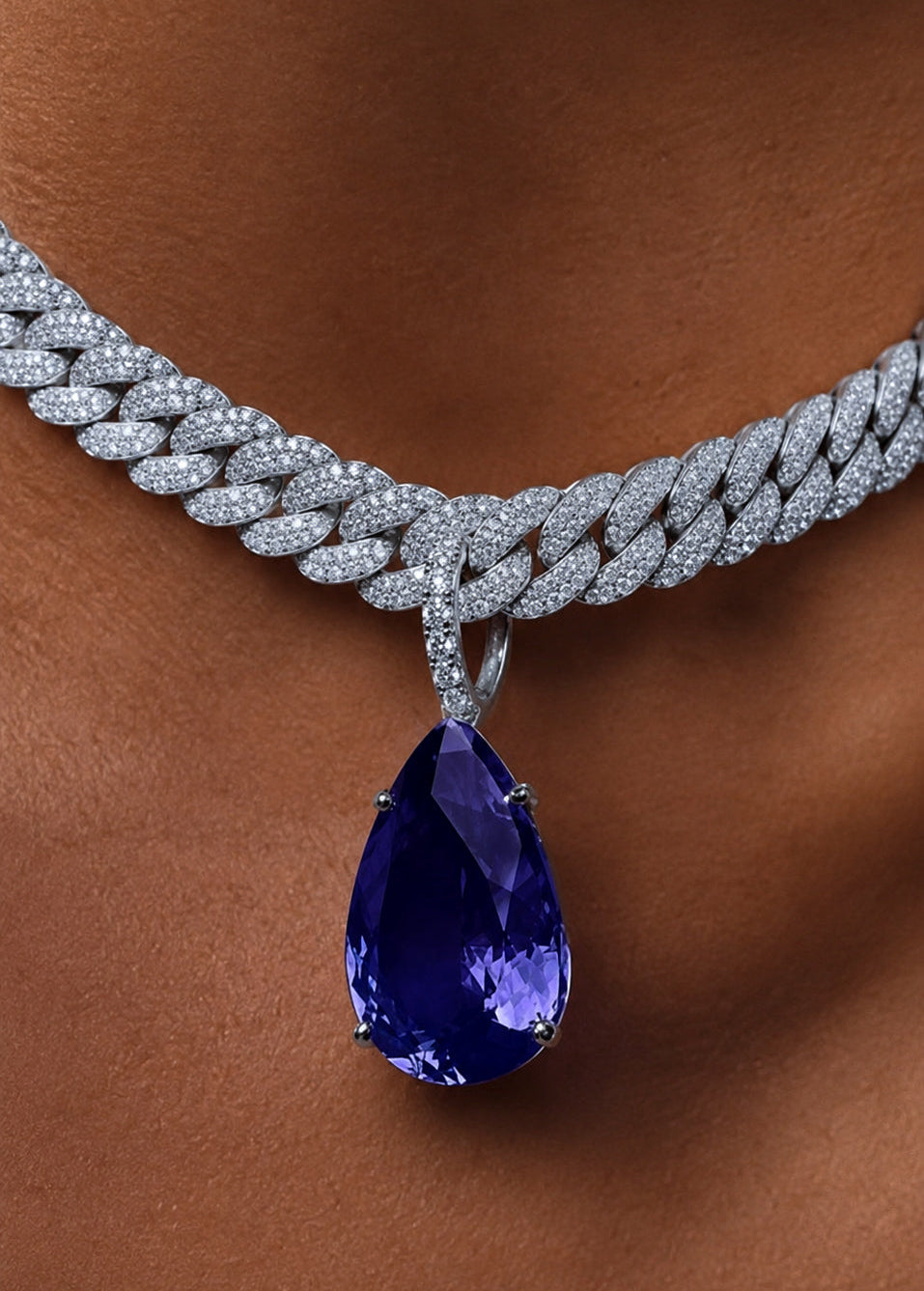 Heiress Sapphire pear pendant in white gold and diamond opening enhancer bail styled on model— Waltz Diamonds