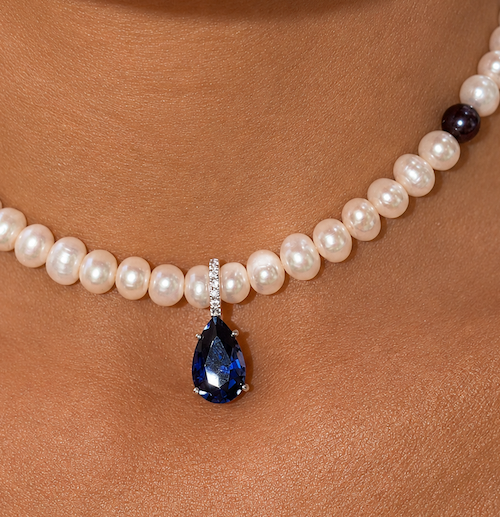 Heiress Sapphire pear pendant in white gold and diamond opening enhancer bail styled with fallen halo pearls— Waltz Diamonds