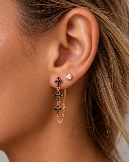 Holy Trinity diamond chain earrings A pair of rose gold dangle earrings with three black diamond crosses on ear — Waltz Diamonds