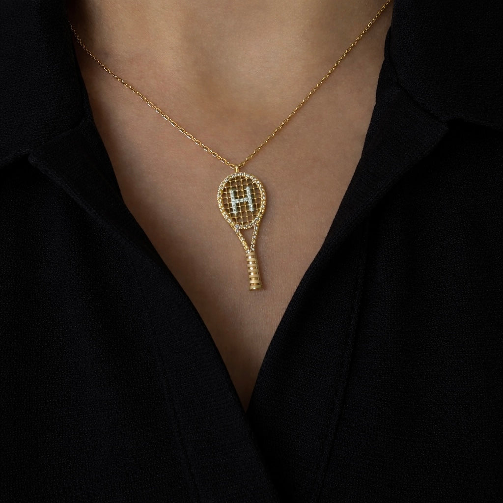 Love all diamond tennis racket pendant in yellow gold worn on model—Waltz Diamonds