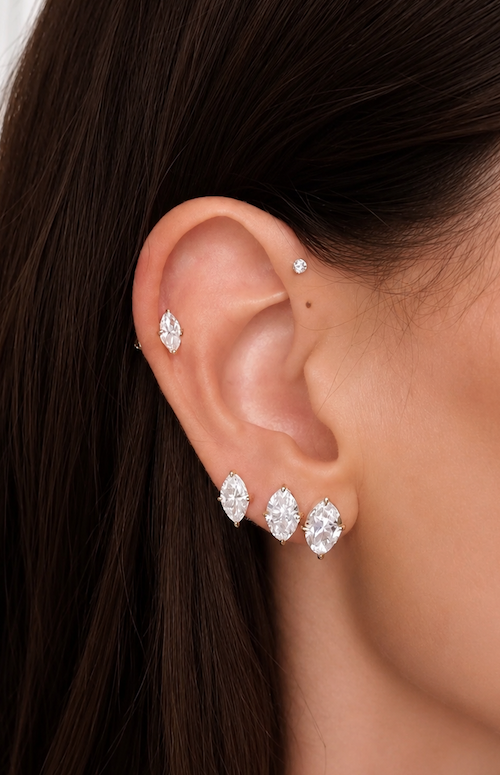 Marquise stud earrings worn on ear — Waltz Diamonds